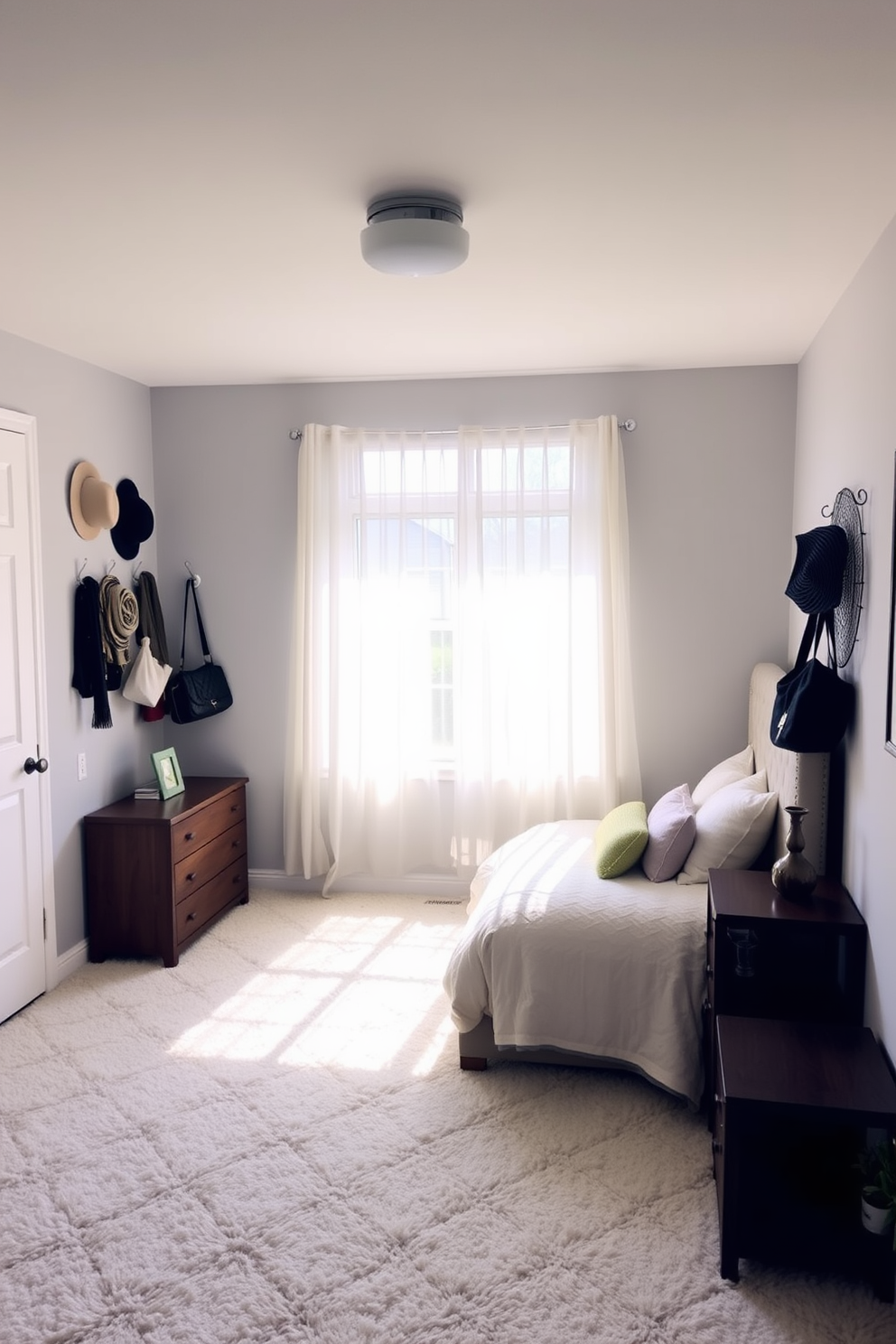 A cozy 10x10 bedroom featuring a soft color palette with light gray walls and a plush white carpet. Wall hooks are creatively used to display accessories such as hats and bags, adding a functional yet decorative touch to the space. The bed is positioned against one wall with a stylish headboard, complemented by bedside tables on either side. Natural light pours in through a window adorned with sheer curtains, creating a warm and inviting atmosphere.