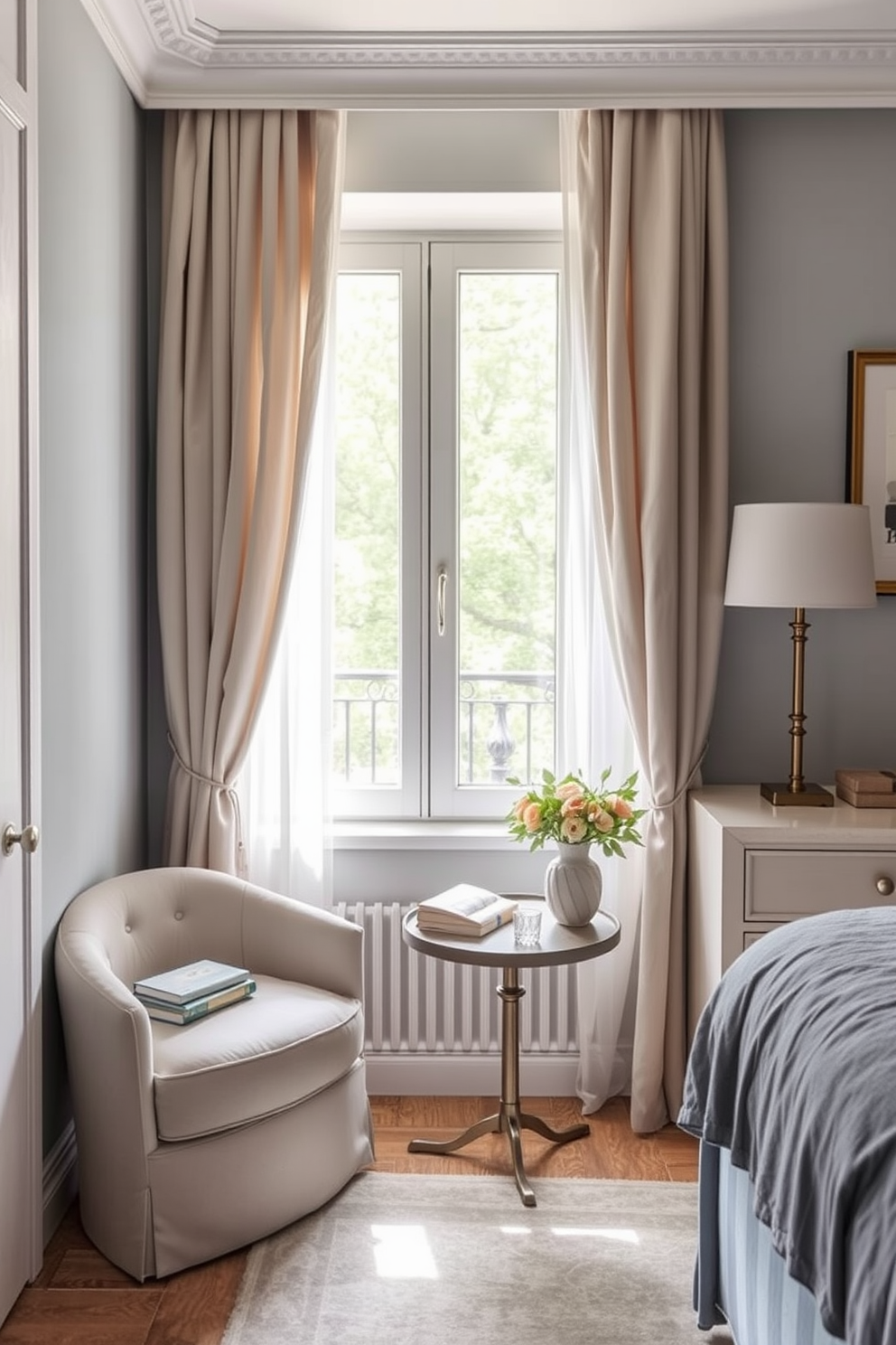 A cozy reading nook by the window features a plush armchair upholstered in soft fabric. A small side table holds a stack of books and a warm cup of tea, while sheer curtains gently filter the sunlight. The bedroom design ideas for a two-bedroom apartment include a calming color palette of soft blues and whites. Each room is furnished with stylish yet functional pieces, maximizing space while ensuring comfort and elegance.