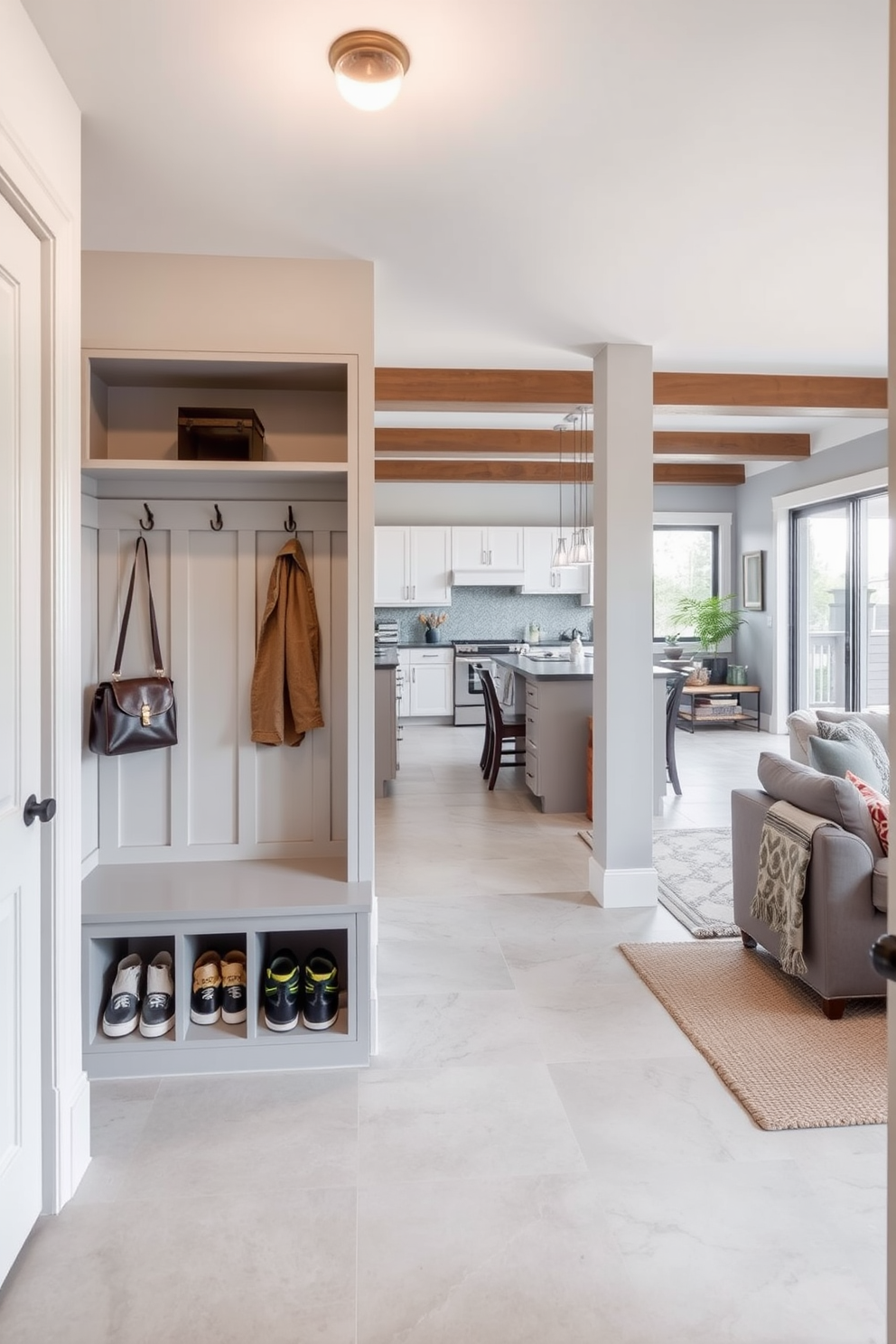 A functional mudroom features built-in storage solutions including a bench with cubbies for shoes and hooks for coats. The walls are painted in a light gray hue, and the floor is covered in durable tile for easy cleaning. The design ideas for a two-story apartment include an open-concept living area that seamlessly connects to the kitchen. Large windows flood the space with natural light, while a cozy reading nook is tucked away in a corner for relaxation.