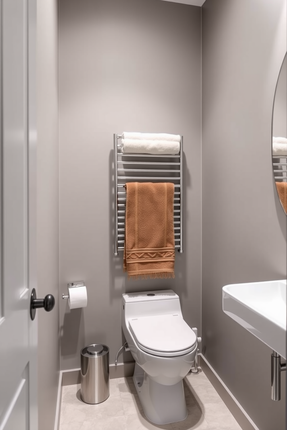 A stylish 5x7 bathroom design featuring a contemporary towel rack installed above the toilet. The space incorporates a sleek color palette with soft gray walls and elegant white fixtures.