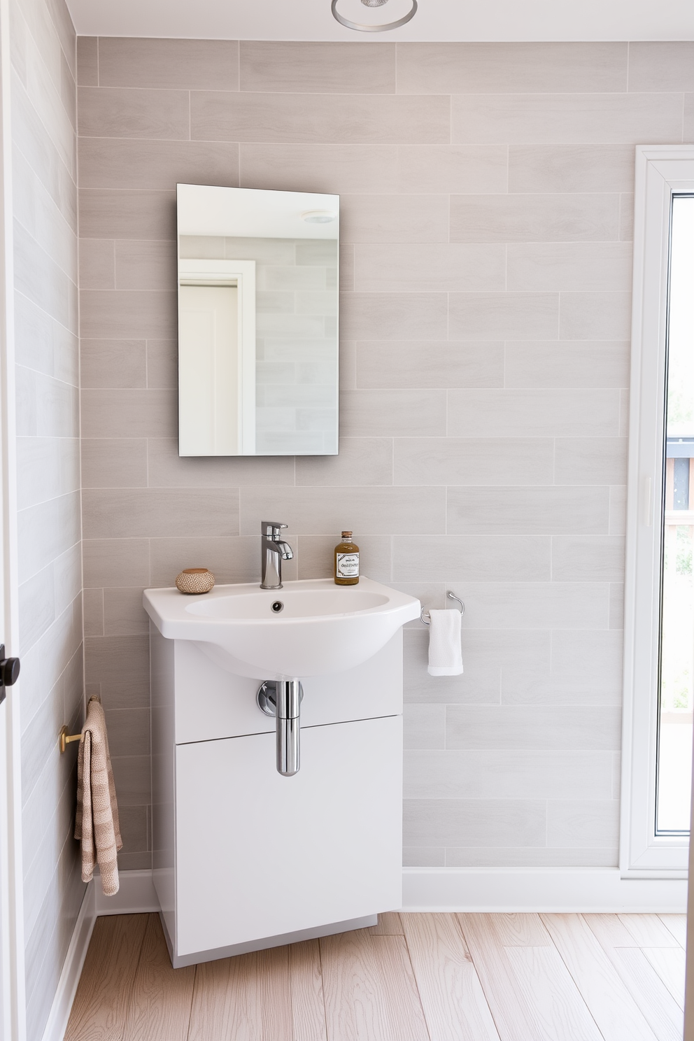 A compact corner sink is installed in a stylish 8x10 bathroom, maximizing the use of space while maintaining a modern aesthetic. The walls are adorned with soft gray tiles, and a sleek mirror above the sink reflects the natural light coming from a nearby window. Adjacent to the sink, a small wooden shelf holds neatly folded towels and decorative items, adding warmth to the space. The floor features light-colored wood planks, creating a cozy and inviting atmosphere in the bathroom.