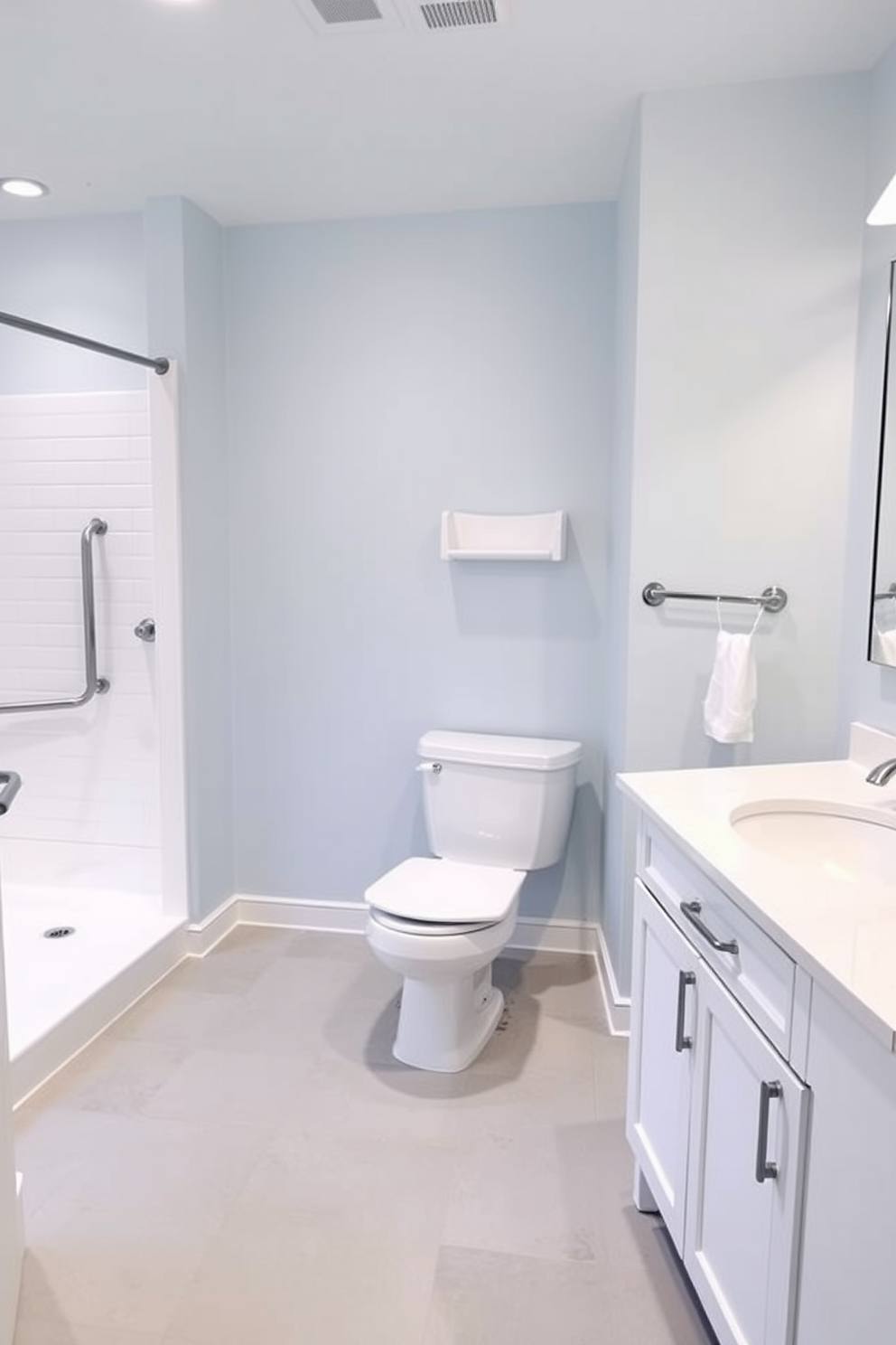 A spacious ADA-compliant bathroom featuring clear floor space for easy maneuverability. The design includes grab bars next to the toilet and shower, with a roll-in shower that has a foldable shower seat. The walls are painted in a calming light blue, complemented by non-slip flooring for safety. A modern vanity with an accessible sink and ample counter space enhances functionality while maintaining an elegant aesthetic.