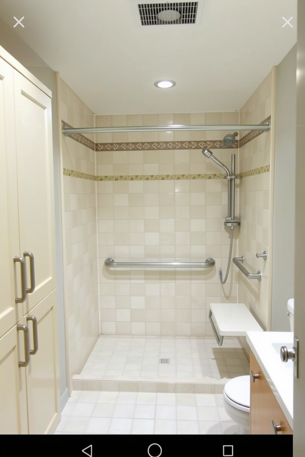 A spacious ADA compliant bathroom featuring easy-to-grip cabinet handles and knobs. The design includes a roll-in shower with grab bars and a bench, ensuring accessibility and comfort for all users.