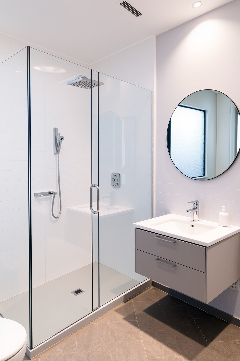 A sleek compact vanity is positioned against the wall, featuring a glossy white finish and a small integrated sink. Above the vanity, a round mirror with a minimalist frame reflects the soft ambient lighting from wall sconces. The walls are painted in a light pastel hue to enhance the sense of space, while the floor is adorned with light gray tiles. A small potted plant sits on the vanity, adding a touch of greenery to the cozy apartment bathroom.