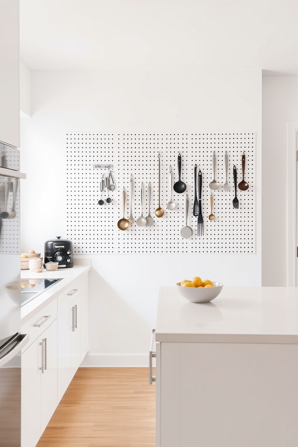 A modern apartment kitchen featuring a pegboard on the wall for hanging various utensils. The space is bright and airy with white cabinetry and a sleek island that doubles as a breakfast bar.