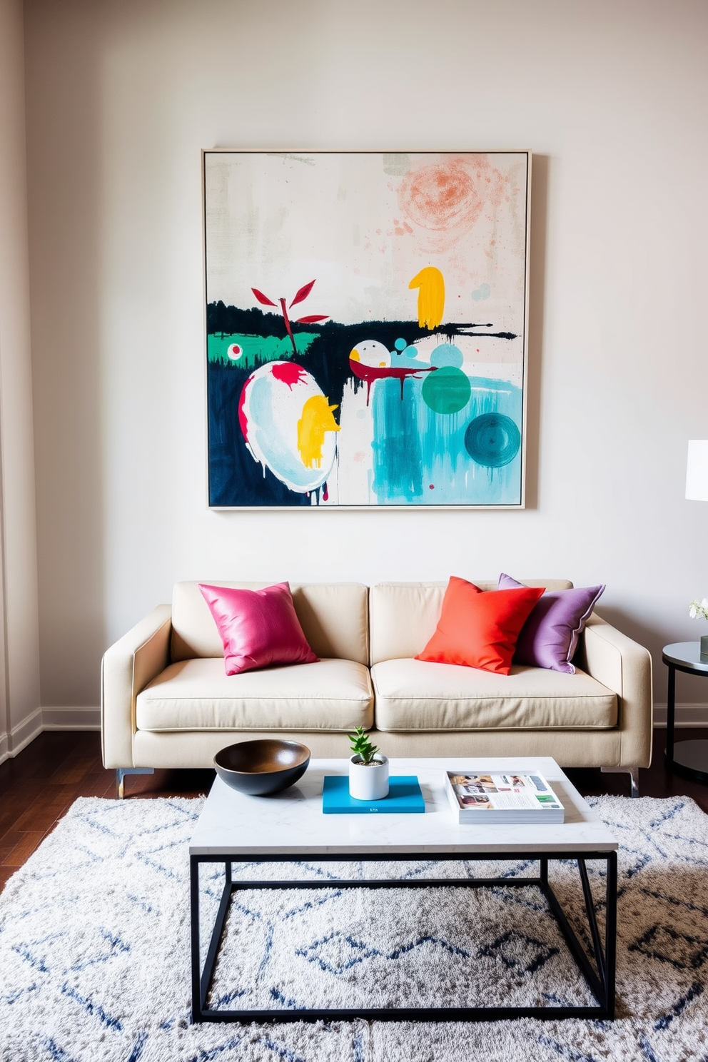 A bright and airy apartment living room features a light-colored sofa with exposed wooden legs, paired with a glass coffee table that reflects natural light. A cozy armchair with a soft fabric and open base complements the seating arrangement, creating an inviting space for relaxation. The walls are adorned with light pastel shades, enhancing the sense of openness, while large windows allow sunlight to flood the room. A stylish area rug anchors the space, adding texture and warmth beneath the furniture.