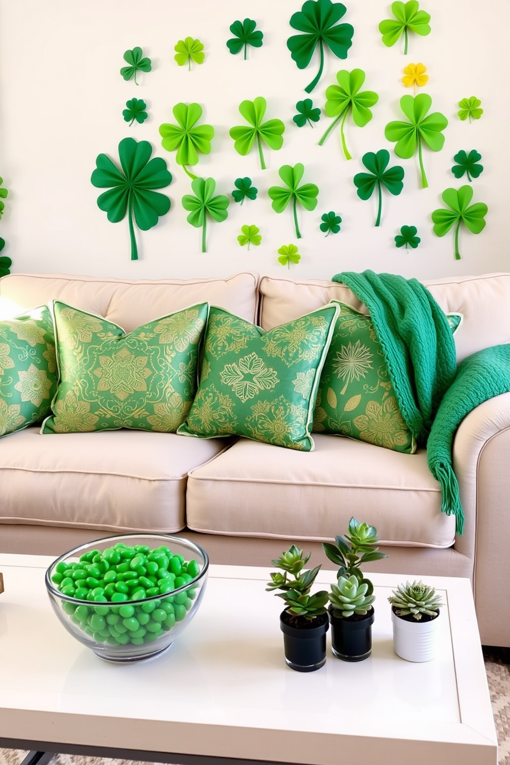 A cozy living room adorned with St. Patrick's Day themed throw pillows featuring vibrant green and gold patterns. The pillows are arranged on a plush beige sofa, complemented by a festive green throw blanket draped over the armrest. In the background, a cheerful display of shamrock decorations hangs on the wall. A small coffee table is set with a decorative bowl filled with green candies and a few potted plants for a fresh touch.