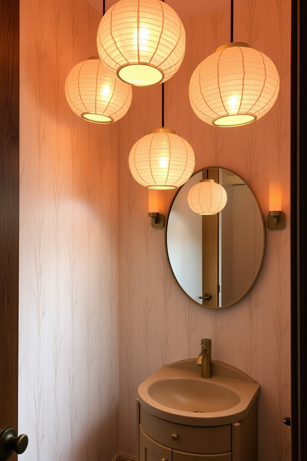 A serene powder room with warm lighting created by soft paper lanterns hanging from the ceiling. The walls are adorned with delicate bamboo wallpaper, and a small wooden vanity features a round sink with a brushed gold faucet.