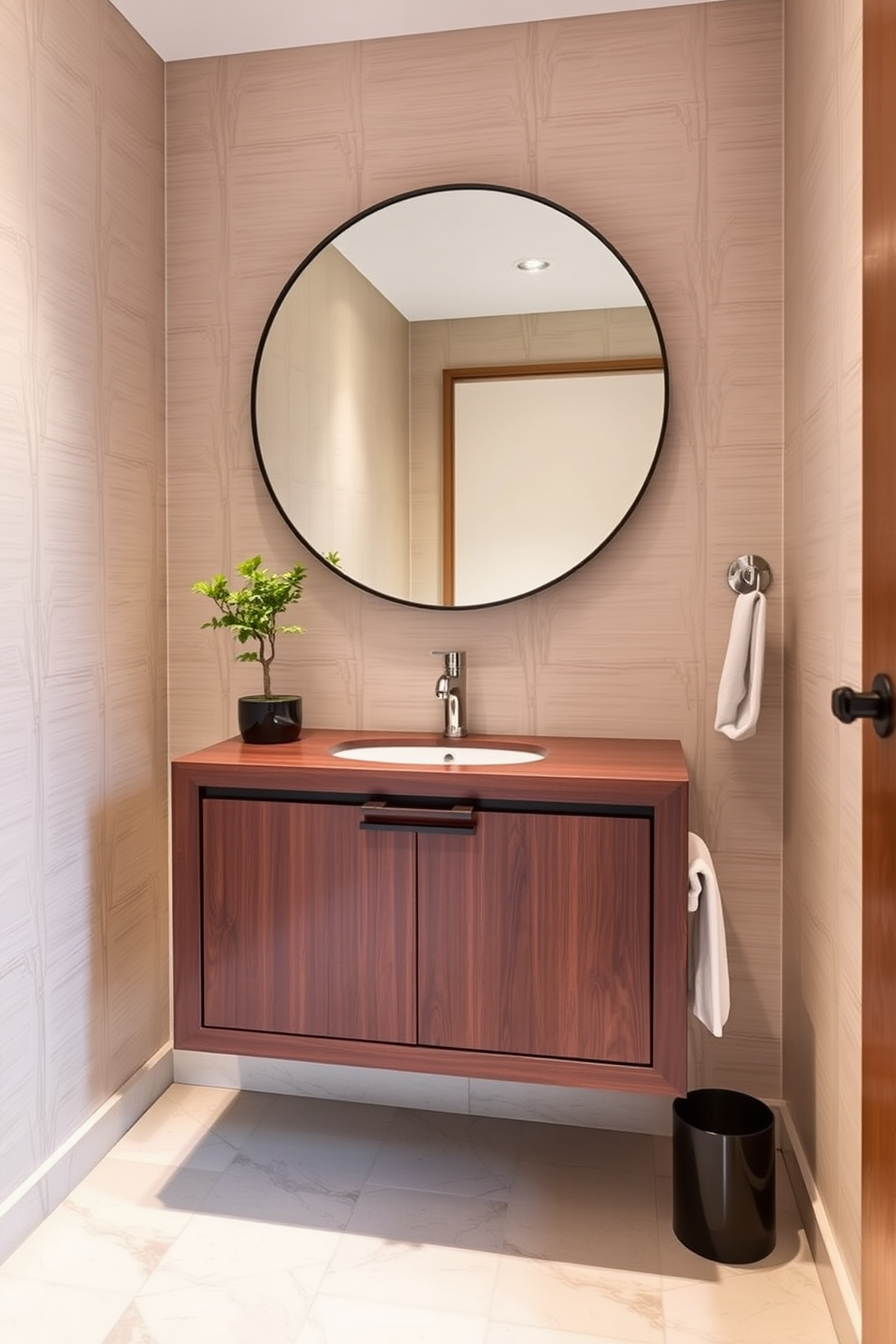 A sleek Asian style floating vanity is the focal point of this elegant powder room. The vanity features clean lines and a rich wood finish, complemented by a large round mirror above it that enhances the sense of space. The walls are adorned with delicate bamboo wallpaper, creating a serene atmosphere. Soft lighting highlights the subtle textures, while a small potted bonsai adds a touch of nature to the design.