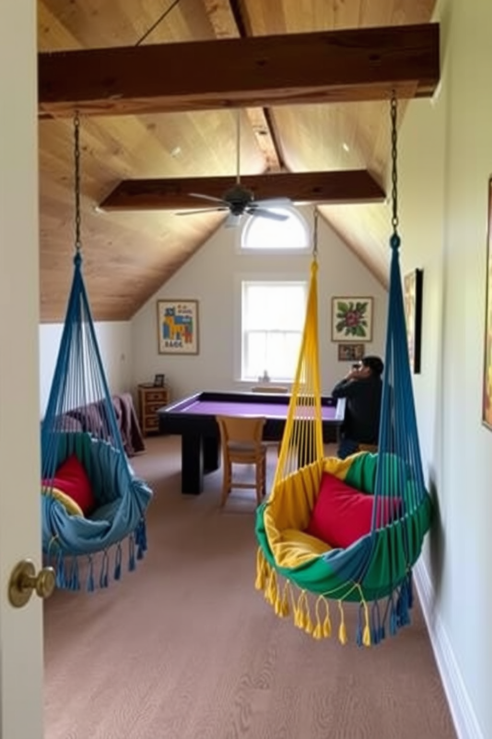 A cozy attic game room featuring colorful hammock chairs that add a playful touch to the space. The walls are adorned with vibrant artwork, and a large window allows natural light to flood in, creating an inviting atmosphere for relaxation and entertainment.