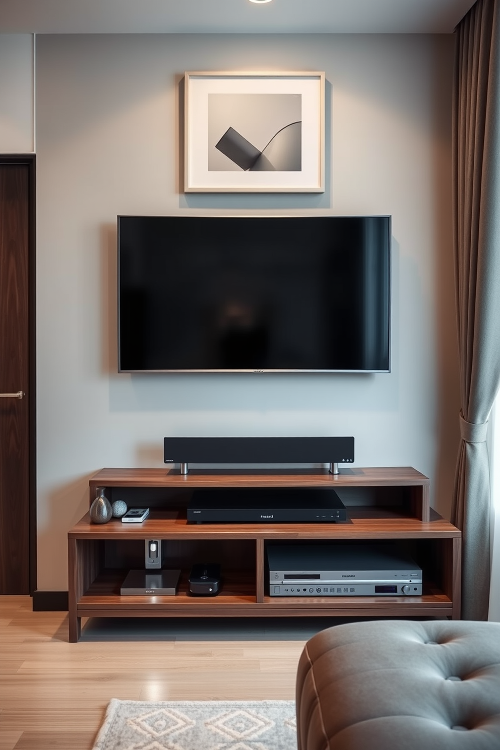 A compact entertainment center designed for a bachelor apartment features sleek lines and a modern aesthetic. The unit includes a low-profile TV stand with open shelving for media devices and decorative items, finished in a rich walnut wood. Above the entertainment center, a wall-mounted flat-screen TV is framed by minimalist artwork. Soft ambient lighting highlights the space, creating a cozy atmosphere ideal for relaxation and entertainment.