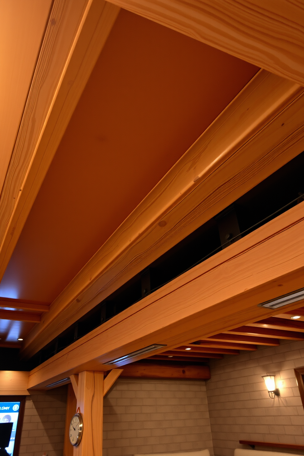 A cozy basement space featuring exposed wooden beams that add rustic charm to the overall design. The ceiling showcases a warm, natural wood finish that complements the soft ambient lighting throughout the room. The walls are painted in a light neutral color to enhance the feeling of openness. Plush seating arrangements and decorative accents create an inviting atmosphere perfect for relaxation and entertainment.