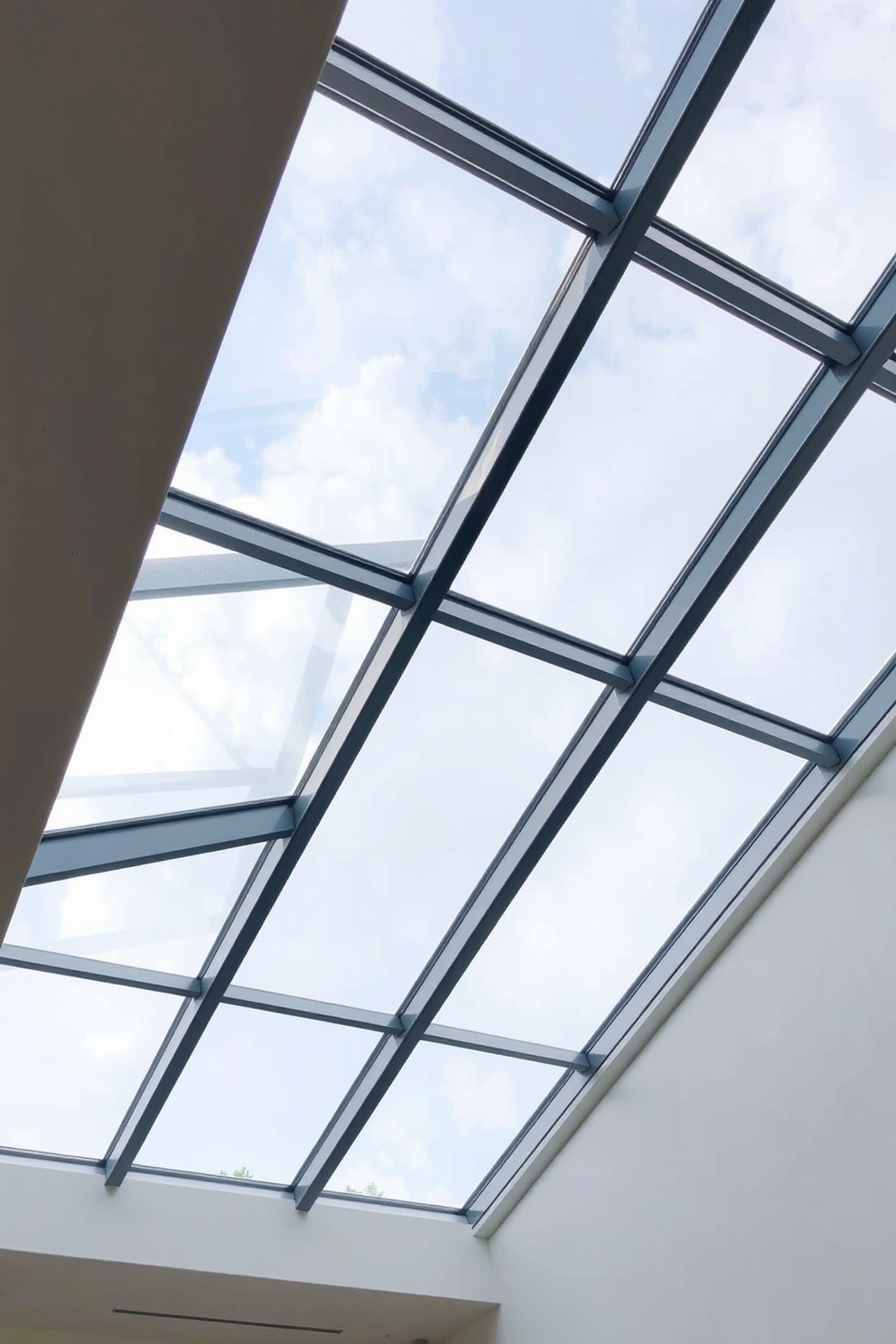 A modern basement ceiling features sleek glass panels that create an airy and open atmosphere. The panels are strategically placed to allow natural light to filter through, enhancing the overall brightness of the space.