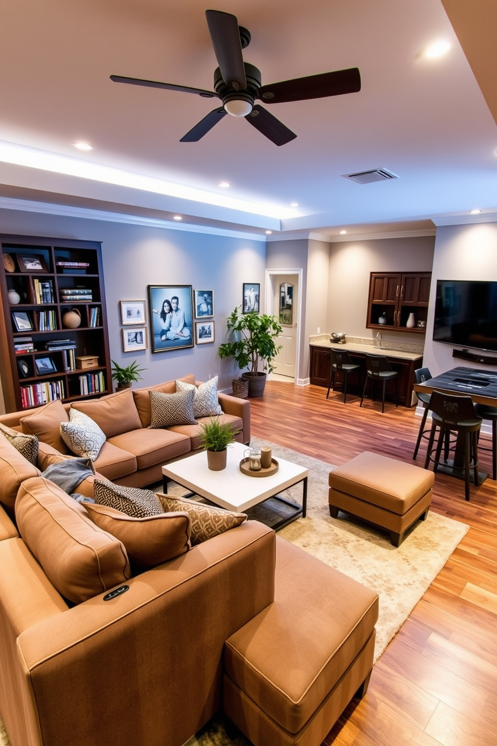 Warm family room with a plush sectional sofa centered around a modern coffee table. The walls are adorned with family photos and soft lighting creates a cozy ambiance. In the corner, a tall bookshelf filled with books and decorative items adds personality to the space. A large area rug anchors the seating area, while a few potted plants bring a touch of nature indoors. Basement design ideas featuring a multifunctional space that serves as both a home theater and a game room. Soft, ambient lighting highlights the comfortable seating and a large screen is mounted on the wall for movie nights. A wet bar with stylish stools provides a perfect spot for entertaining guests. The decor combines rustic elements with contemporary finishes to create a welcoming atmosphere.