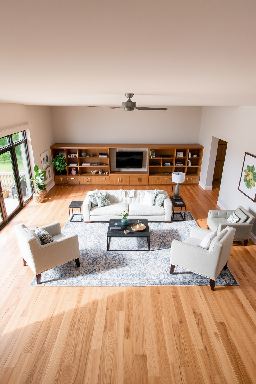 Open layout for flexible furniture arrangement. The space features a combination of light wood flooring and neutral walls, creating a warm and inviting atmosphere. In the center, a large area rug defines the seating area, which includes a plush sectional sofa and a modern coffee table. Surrounding the space, strategically placed accent chairs and side tables allow for versatile seating options. Natural light floods in through large windows, enhancing the open feel of the room. Decorative elements such as plants and artwork add personality and charm to the overall design. Basement design ideas should focus on maximizing usable space while ensuring comfort. Incorporate built-in shelves and cozy nooks for reading or relaxation, making the basement a multifunctional retreat.