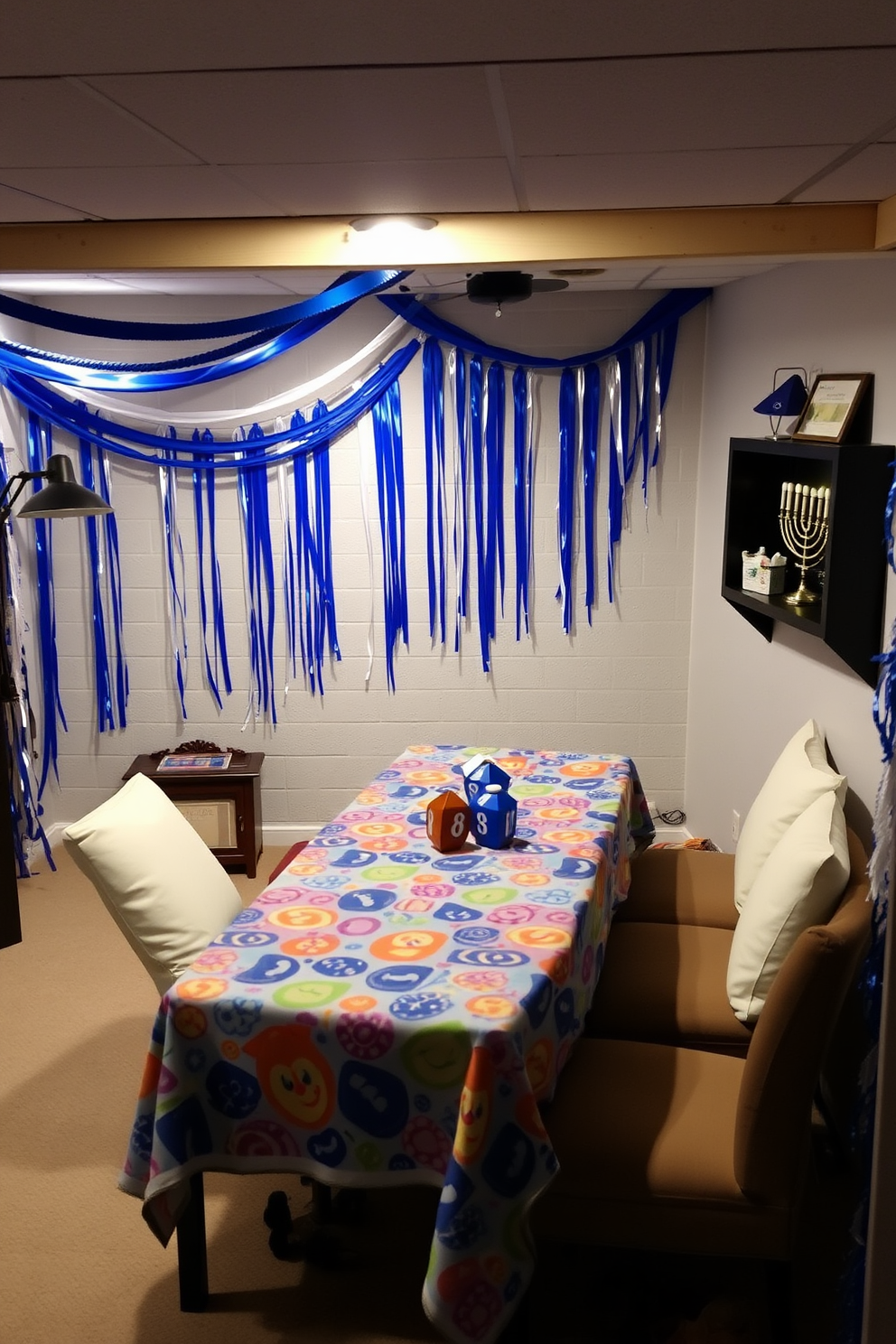 A festive basement setting designed for an interactive dreidel game station. The area features a large table covered with a colorful tablecloth, surrounded by comfortable seating and adorned with Hanukkah decorations. The walls are decorated with blue and white streamers, and a menorah sits prominently on a nearby shelf. Soft lighting creates a warm atmosphere, enhancing the joyful spirit of the Hanukkah celebration.