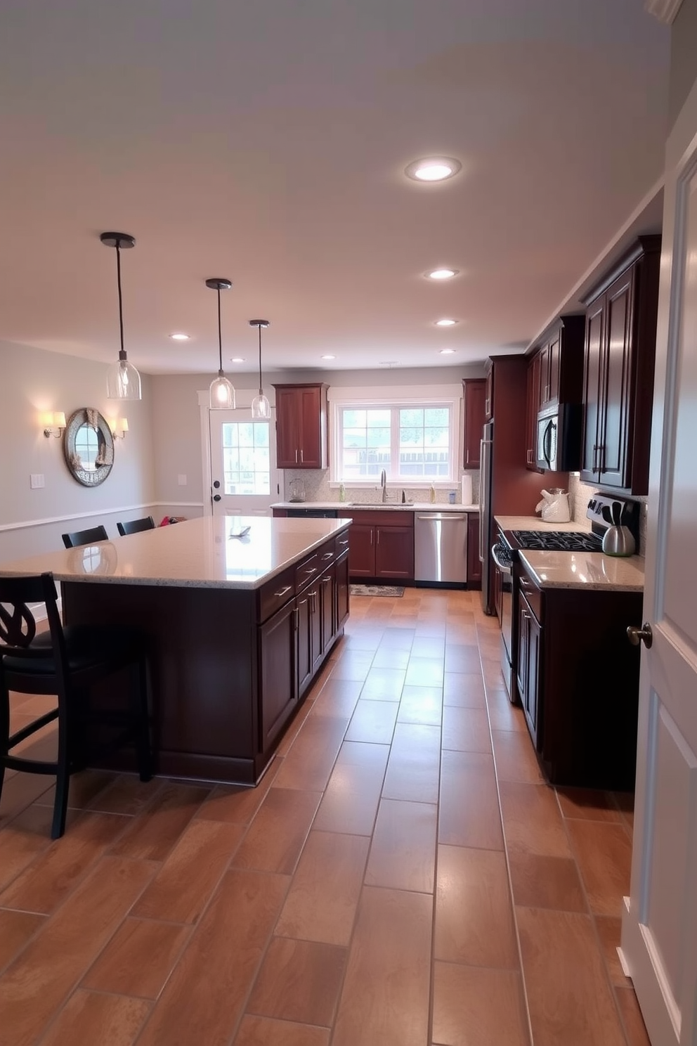 A spacious basement kitchen featuring tile flooring for easy maintenance. The kitchen includes modern stainless steel appliances and a large island with bar seating.