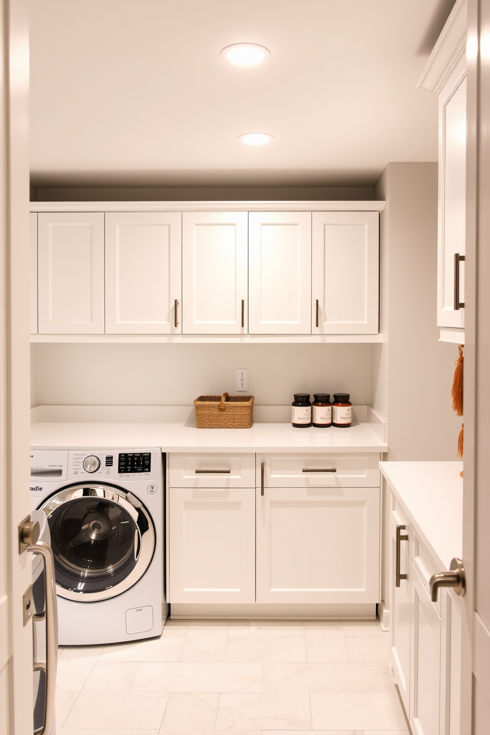 Bright white cabinetry with bold accents creates a striking contrast in the basement laundry room. The space features sleek countertops and modern appliances, enhancing both functionality and style.