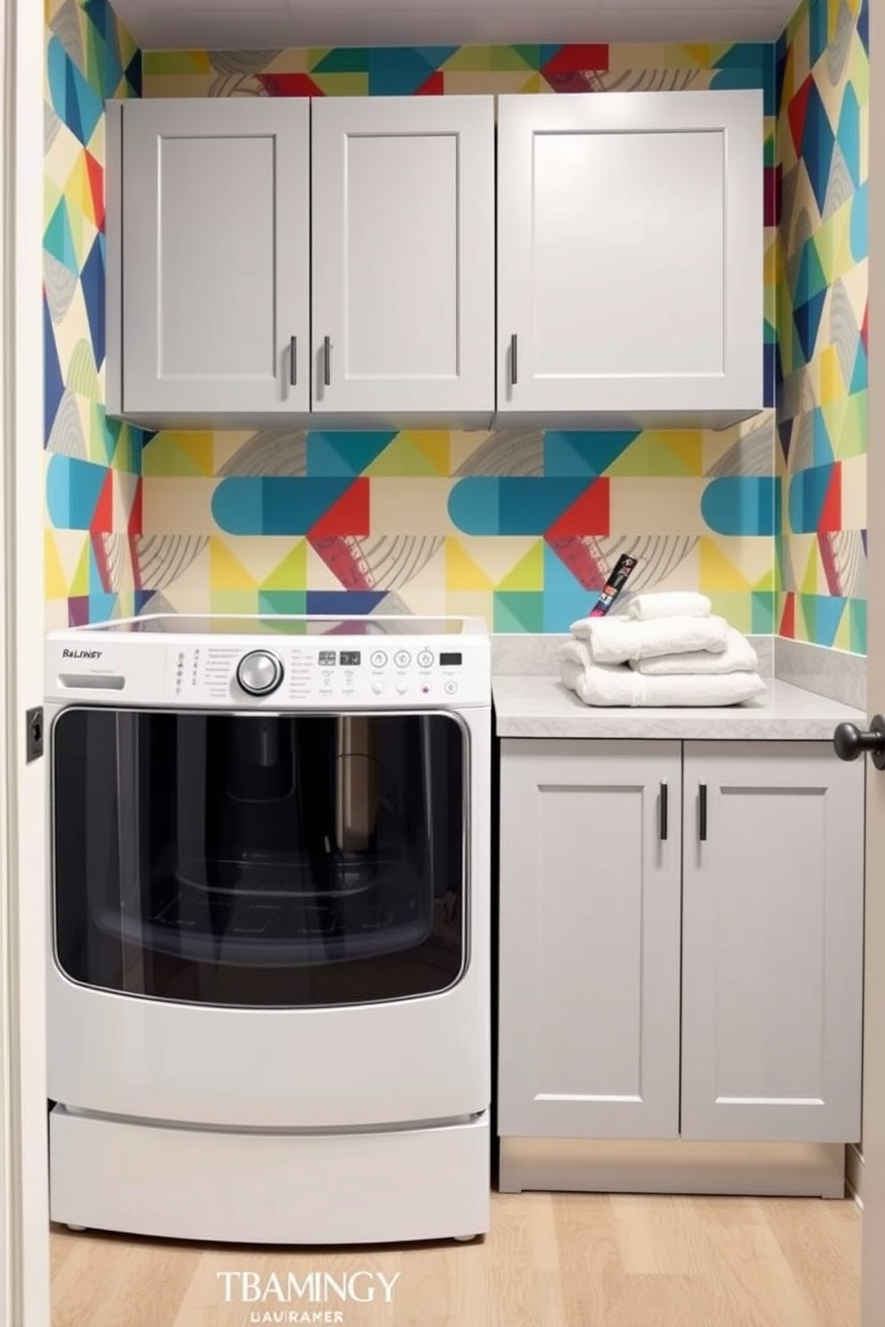 Create a basement laundry room with geometric wallpaper featuring playful patterns in vibrant colors. The space includes a modern washer and dryer set, with a sleek countertop for folding clothes and ample storage cabinets above.