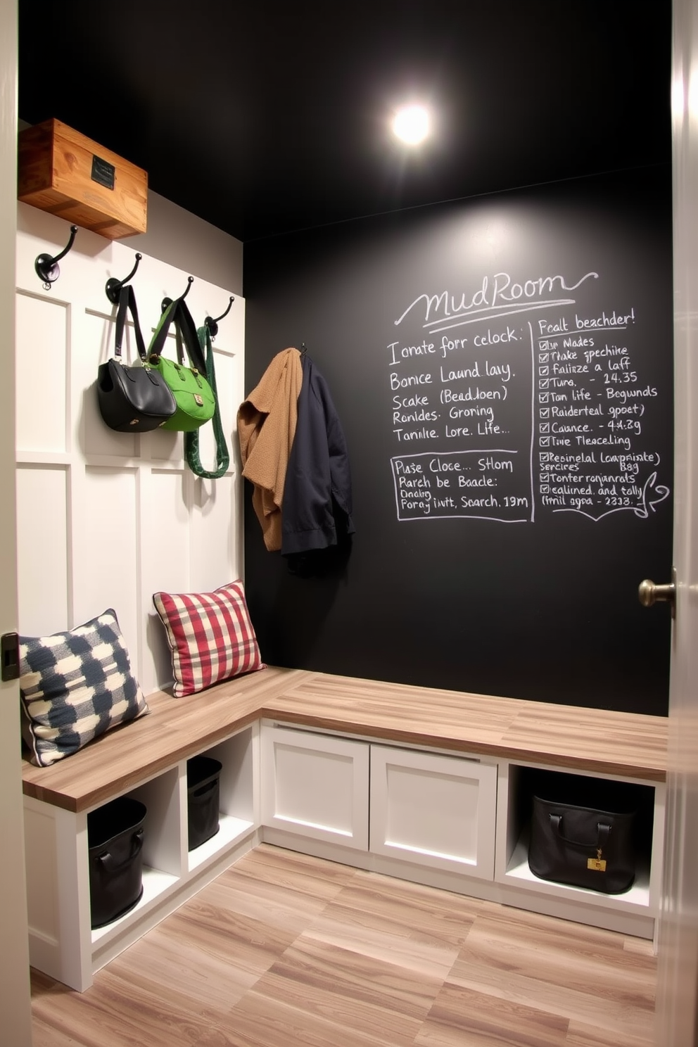 A functional and stylish basement mudroom features a chalkboard wall for notes and reminders, providing a creative touch to the space. The area includes built-in benches with storage underneath, and hooks above for hanging coats and bags, all designed with a modern aesthetic.