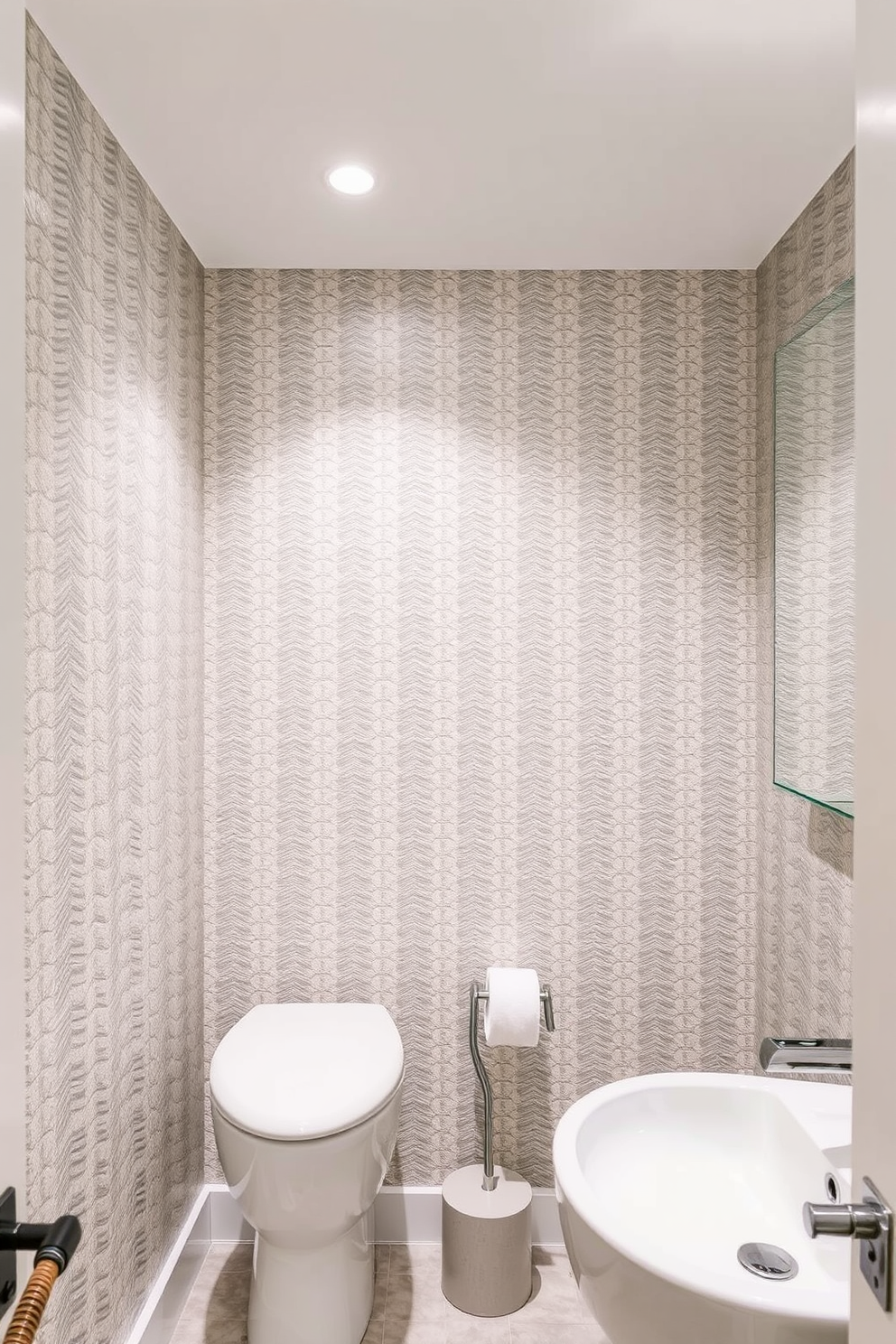 A basement washroom featuring textured wallpaper that adds depth and visual interest to the space. The wallpaper showcases a subtle geometric pattern in soft neutrals, complementing the sleek fixtures and modern lighting.