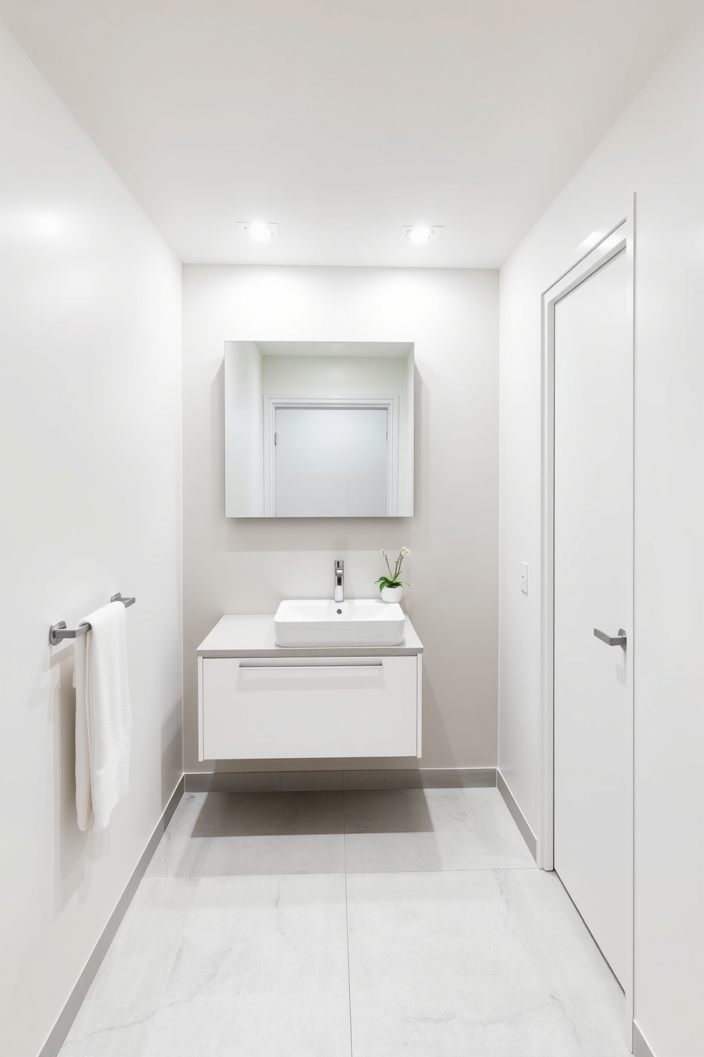 A minimalist basement washroom features sleek fixtures that emphasize functionality and simplicity. The walls are painted in a soft white, and the floor is adorned with light gray tiles for a clean and airy feel. A floating vanity with a single sink showcases a streamlined design, complemented by a large, frameless mirror above it. Modern recessed lighting illuminates the space, while a small potted plant adds a touch of warmth and life.