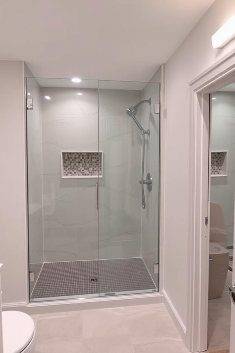 A stylish basement washroom featuring frameless shower doors creates a seamless design that enhances the sense of space. The walls are adorned with elegant tiles, and the flooring is a sleek, moisture-resistant material that complements the overall aesthetic.