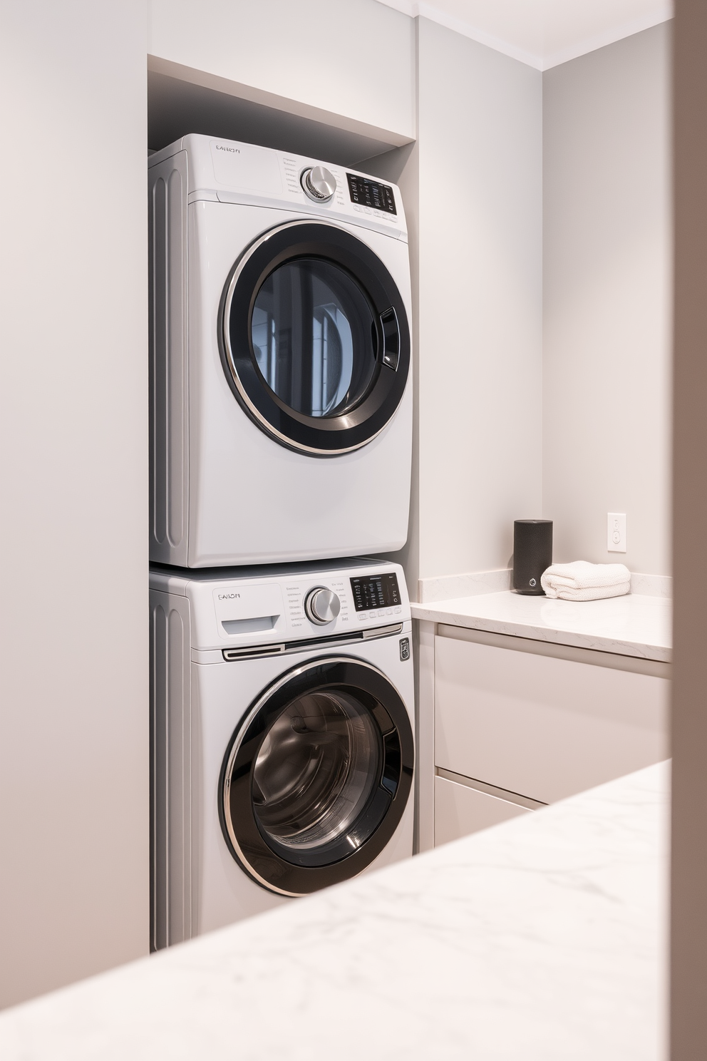 A modern laundry room with smart technology integrated into the design. The space features a sleek washer and dryer stacked with a touchscreen control panel for easy management. The walls are painted in a light gray color to create a clean and airy feel. A minimalist countertop made of quartz provides ample space for folding clothes, and a small smart speaker is placed nearby for hands-free assistance.