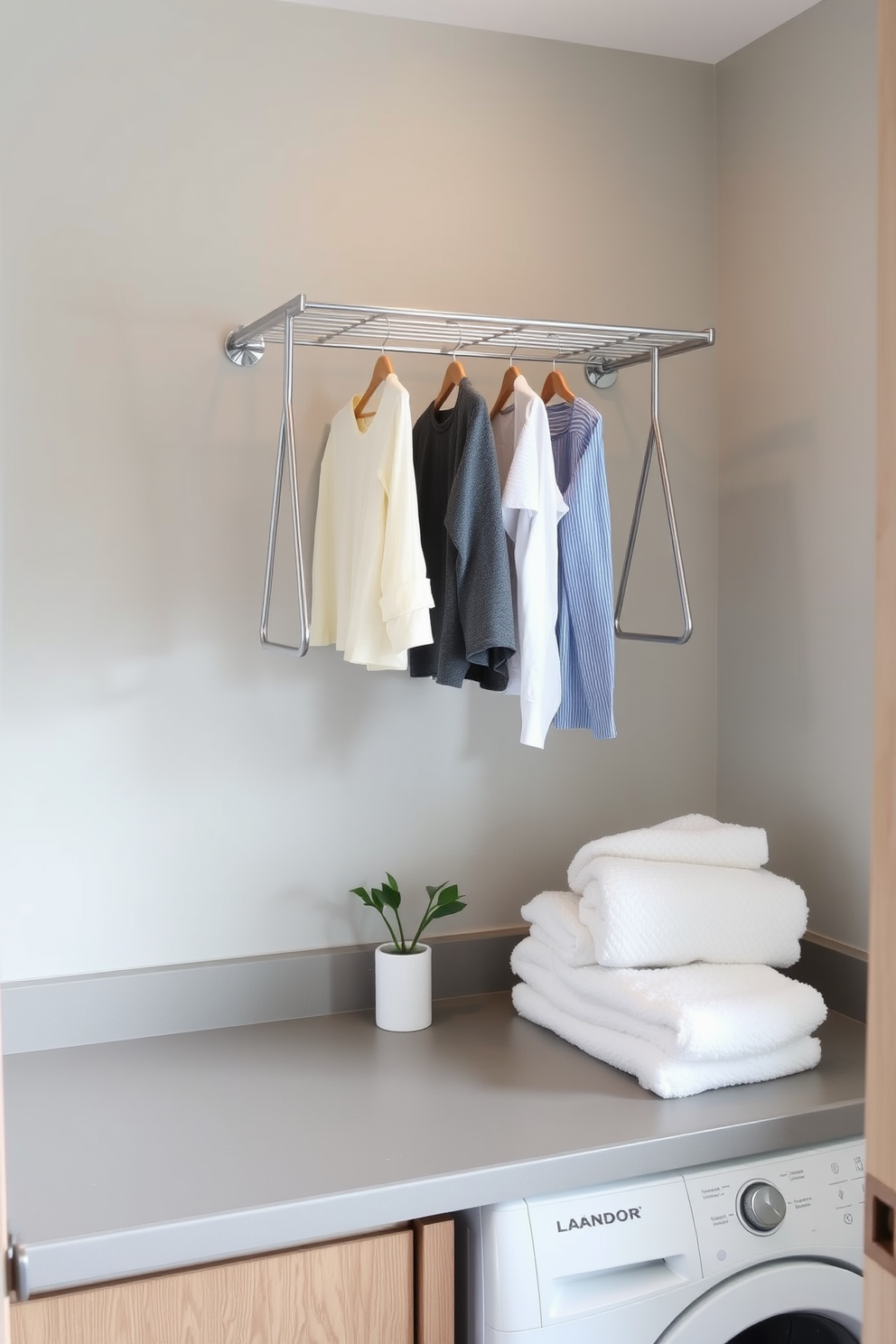 A modern bathroom laundry room combo features a wall-mounted drying rack for clothes, elegantly positioned above a sleek countertop. The space is designed with soft gray walls and warm wooden accents, creating a cozy yet functional atmosphere.