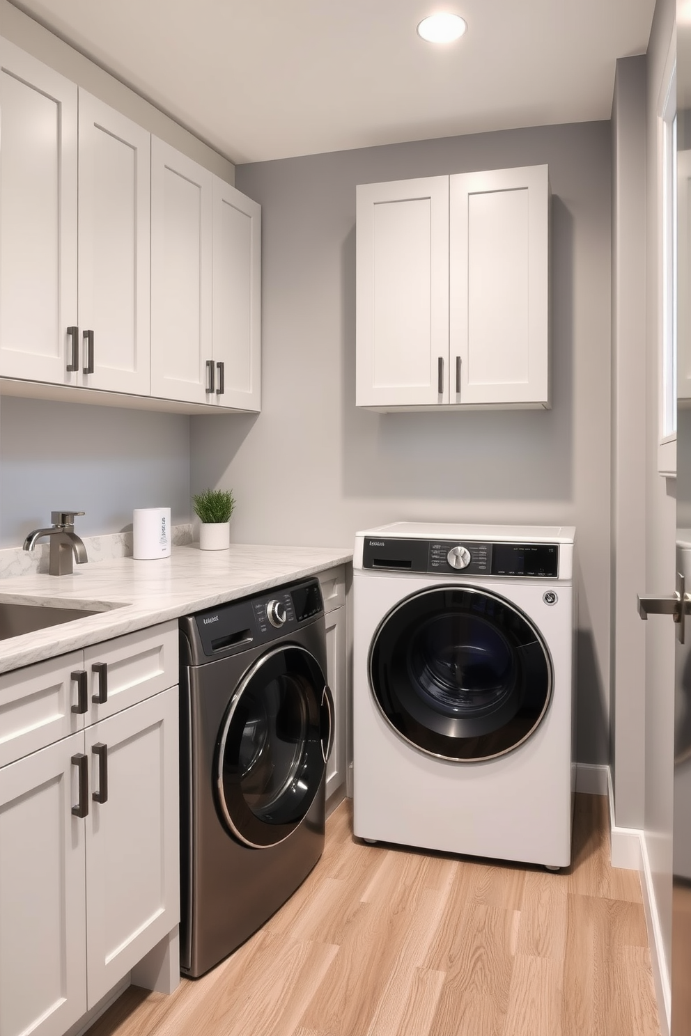 A modern laundry room featuring a wall-mounted drying rack for convenience. The space includes a sleek washer and dryer set, with ample storage cabinets above and a countertop for folding clothes. The walls are painted in a soft blue hue, complemented by white cabinetry and brushed nickel hardware. A stylish laundry basket sits in the corner, and a small potted plant adds a touch of greenery to the room.