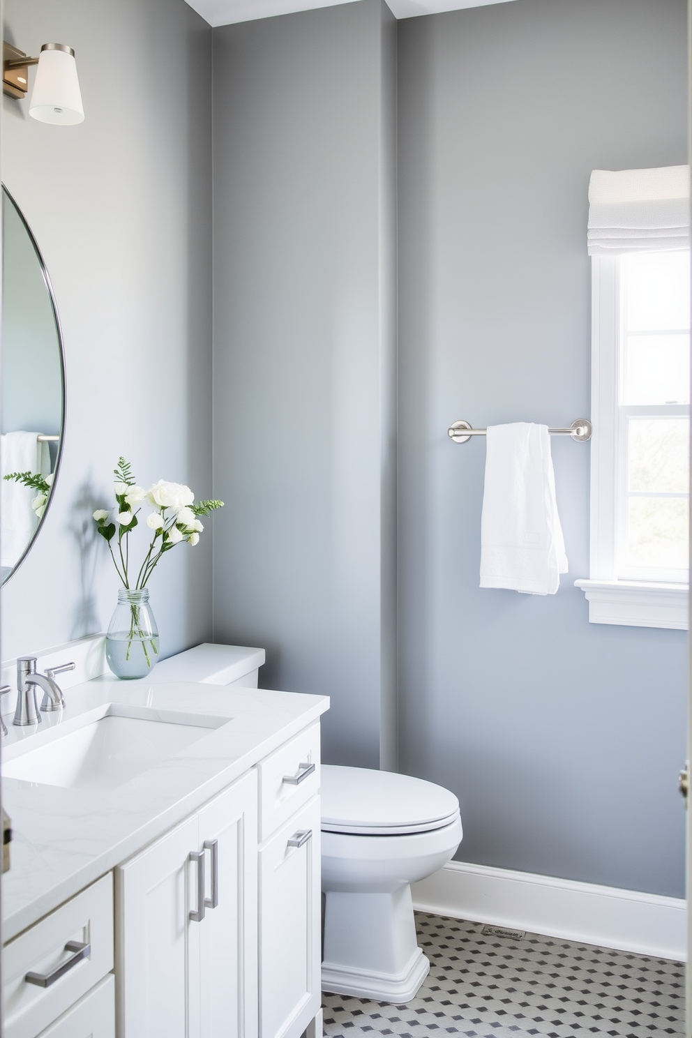 A serene bathroom retreat featuring pale gray-blue walls that evoke a sense of calm. The space is complemented by white cabinetry and brushed nickel fixtures, creating a harmonious and inviting atmosphere.