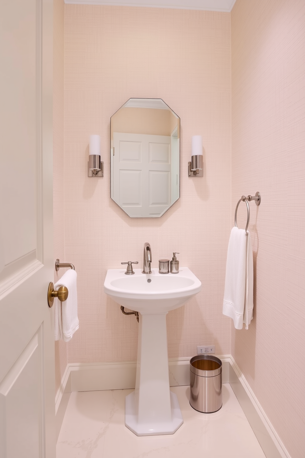 Textured wallpaper in a soft pastel hue adorns the walls, creating a warm and inviting atmosphere. A sleek pedestal sink complements the design, paired with a stylish mirror that enhances the room's elegance. The floor features light-colored tiles with subtle veining, adding a touch of sophistication. Decorative accents like a small potted plant and elegant hand towels complete the inviting look of the powder room.