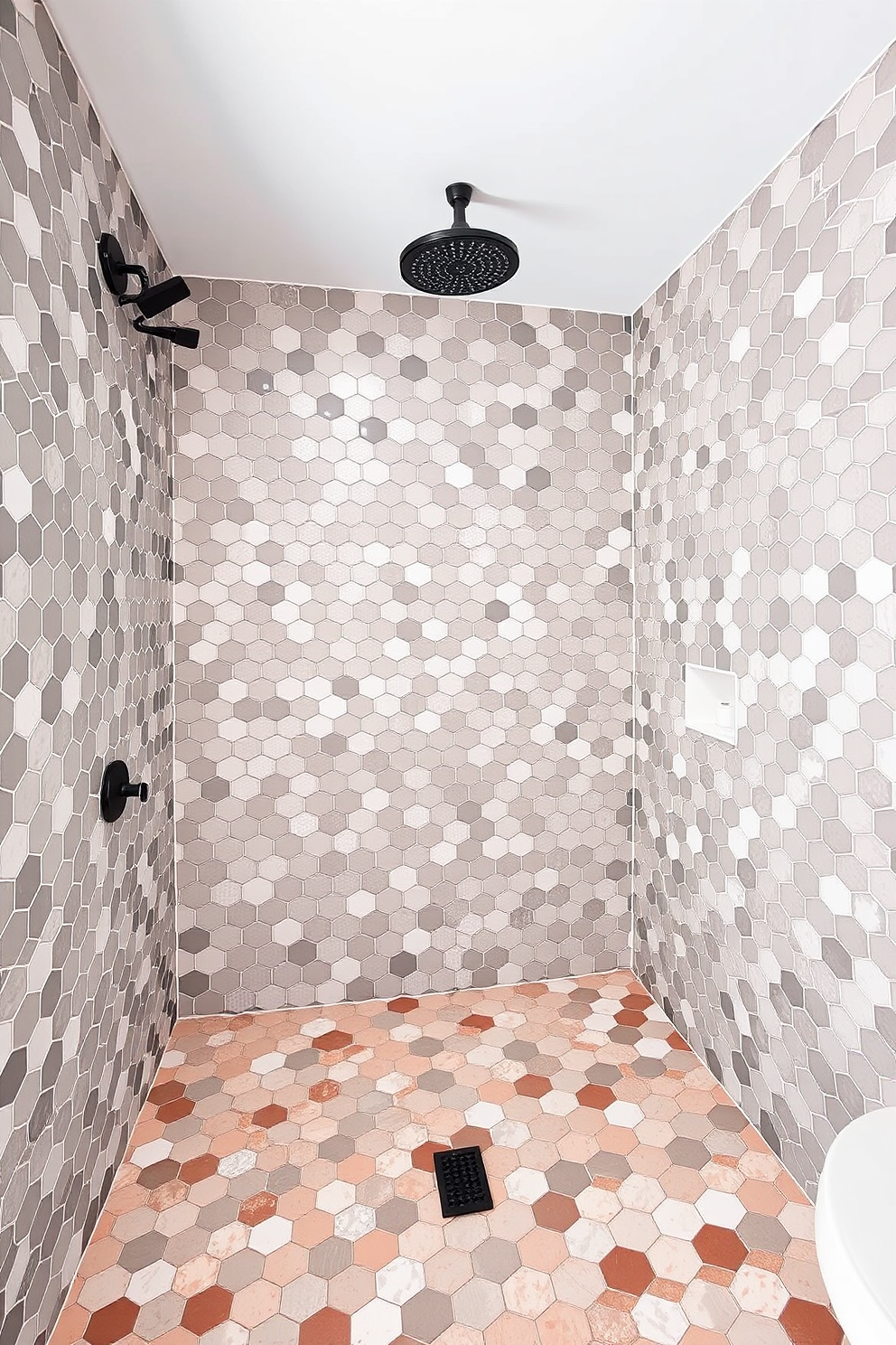 A modern bathroom shower design featuring hexagonal tiles that create a striking geometric pattern on the walls. The floor is adorned with matching hexagonal tiles in a contrasting color, enhancing the overall aesthetic of the space.