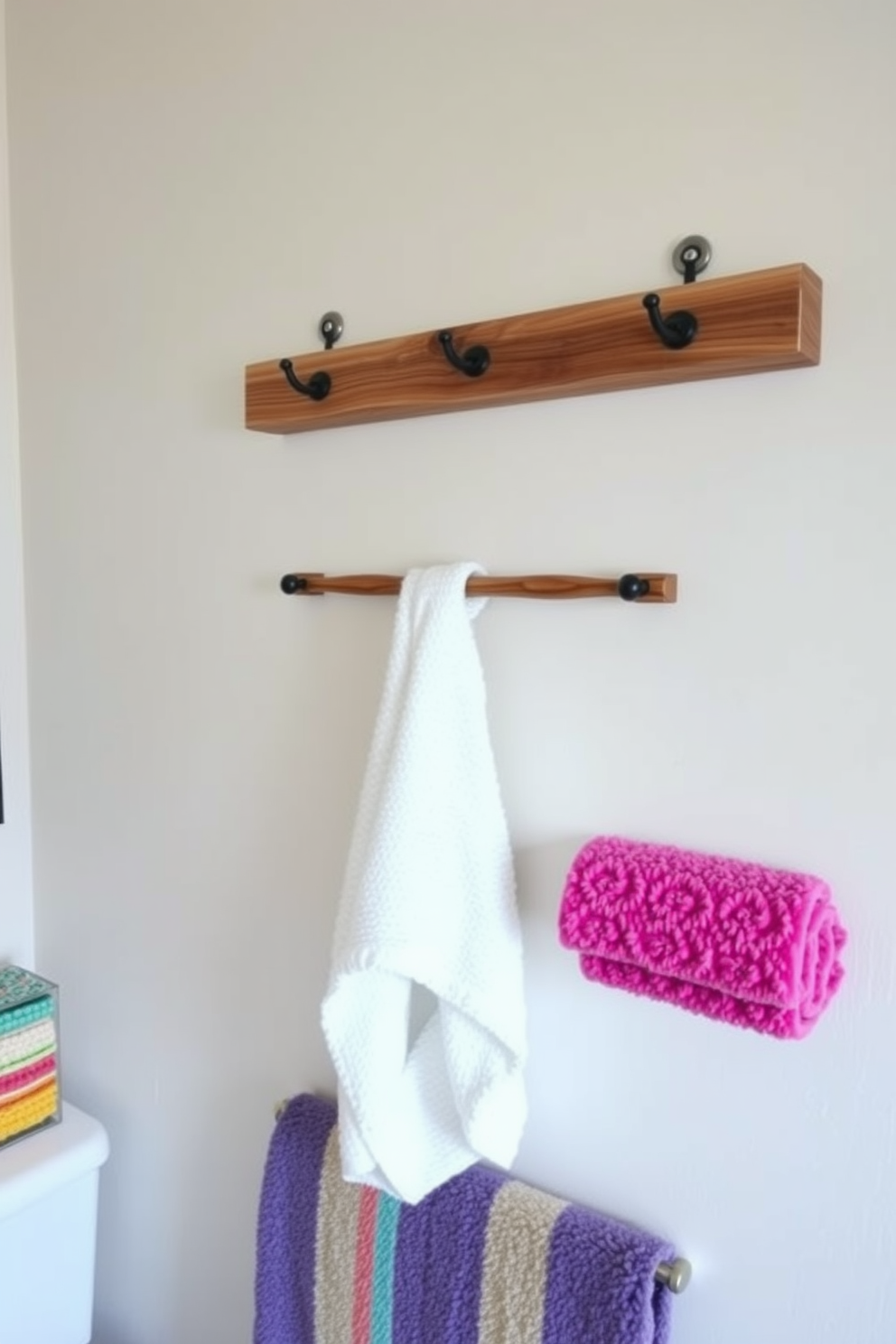 A rustic DIY towel rack crafted from reclaimed wood hangs on the wall, showcasing a unique blend of sustainability and style. The natural grain of the wood adds warmth to the bathroom, complementing the soft color palette of the space. Incorporate various towel design ideas with vibrant colors and patterns to create a lively atmosphere. Use plush, textured towels that enhance the overall aesthetic while providing comfort and functionality.