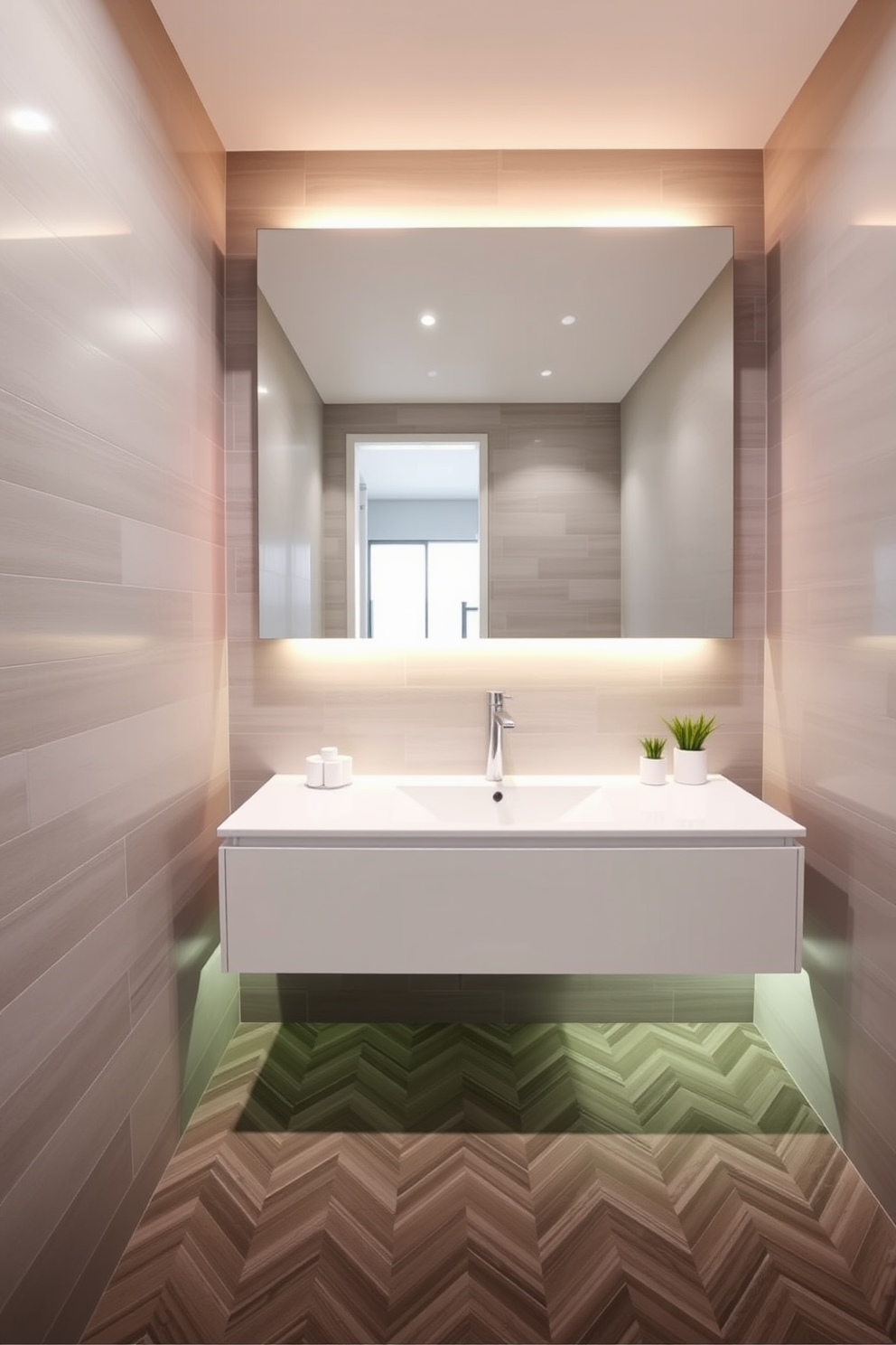 A modern floating vanity with sleek lines is the centerpiece of this bathroom. The vanity features a glossy white finish and is complemented by a large, frameless mirror that enhances the sense of space. Underneath, ambient lighting illuminates the area, creating a warm and inviting atmosphere. The walls are adorned with soft grey tiles, while the floor boasts a chic herringbone pattern in contrasting shades.