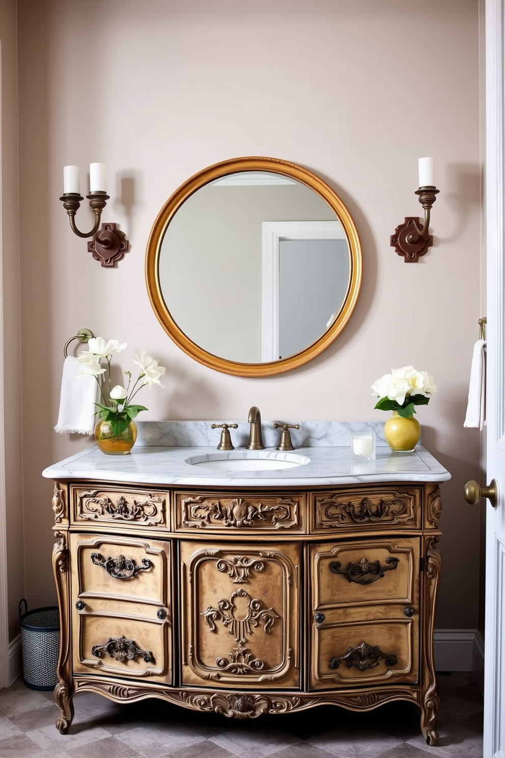 A vintage dresser repurposed as a vanity adds charm to the bathroom. The dresser features ornate carvings and a distressed finish, with a marble top that complements the overall design. Above the dresser, a large round mirror with an antique gold frame reflects the elegance of the space. Flanking the mirror are wall sconces that provide warm lighting, enhancing the vintage aesthetic.