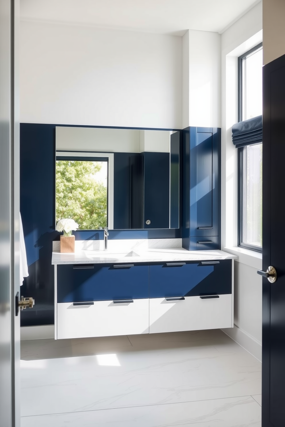 A stylish bathroom featuring dual-tone cabinetry that creates a trendy contrast. The upper cabinets are a sleek white while the lower cabinets are a deep navy blue, providing a modern and chic look. The vanity is complemented with a polished quartz countertop that adds elegance to the space. Above the vanity, a large frameless mirror reflects the natural light pouring in from a nearby window.