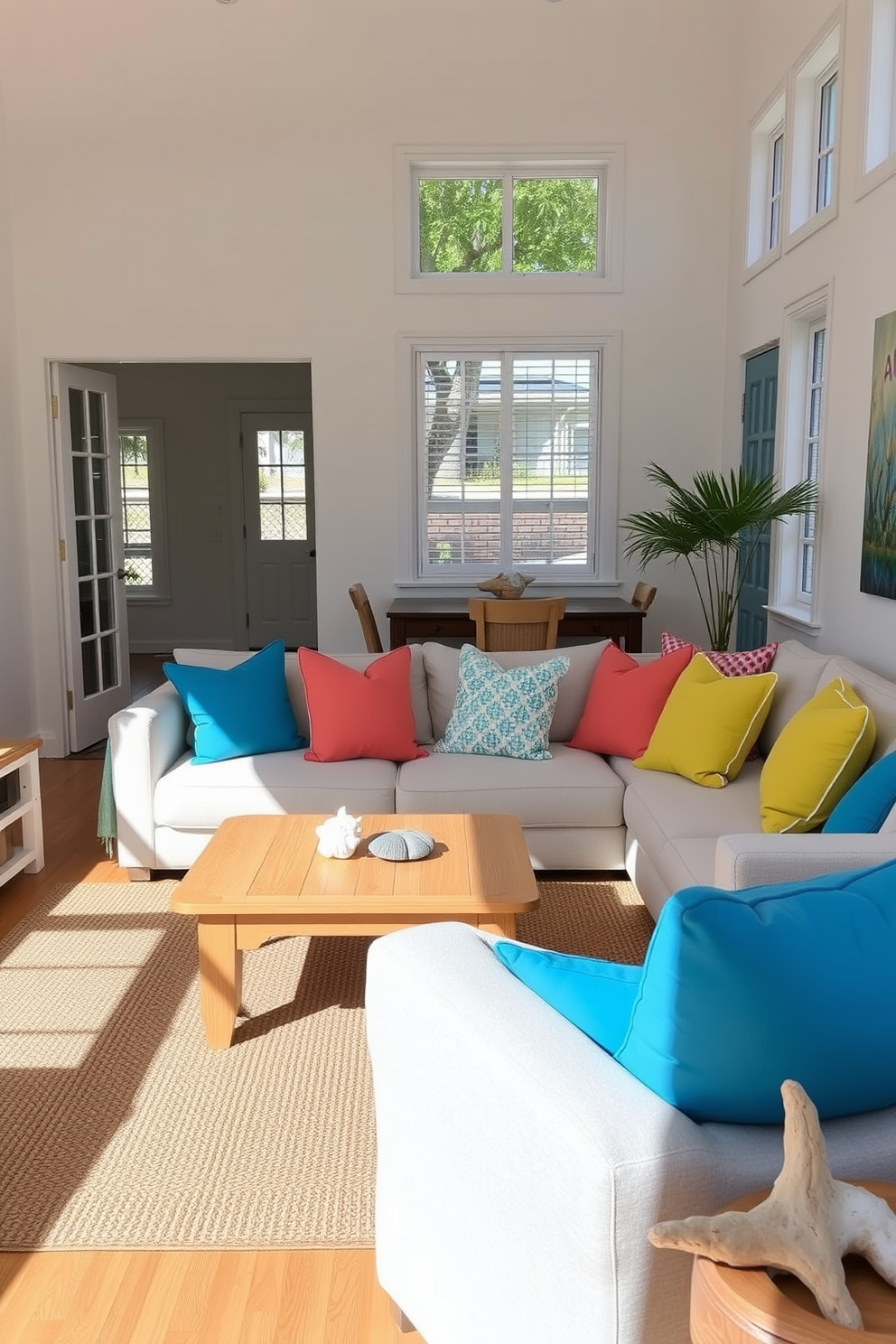 Beachy throw pillows in bright colors adorn a cozy sectional sofa in a sunlit living room. The walls are painted in a soft white, and large windows allow natural light to flood the space, highlighting the vibrant hues of the pillows. A light wood coffee table sits in front of the sofa, surrounded by a jute rug that adds texture to the room. Nautical decor elements, such as seashells and driftwood, complete the beach apartment design, creating a relaxed and inviting atmosphere.