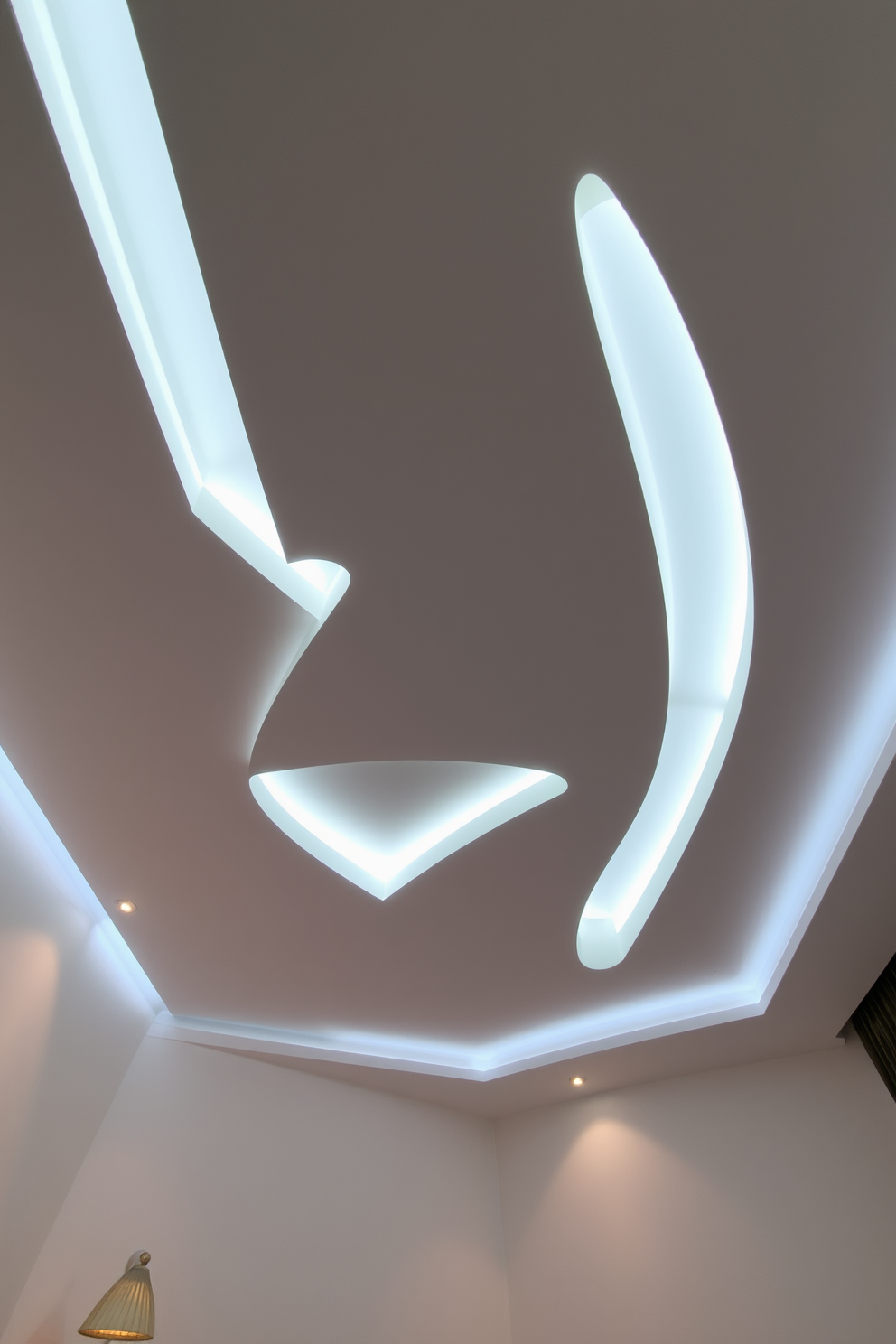 A suspended ceiling features unique geometric shapes that create a modern and dynamic atmosphere in the bedroom. Soft LED lighting is integrated into the design, casting a warm glow that enhances the overall ambiance.