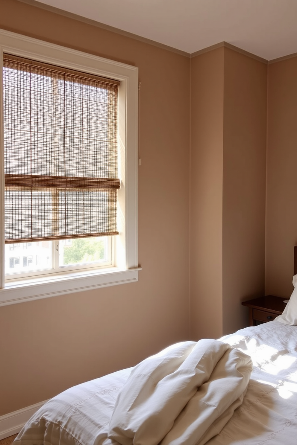 A serene bedroom featuring bamboo shades that filter natural light gently into the space. The walls are painted in soft earth tones, and a cozy bed with organic cotton linens is positioned under the window adorned with the bamboo shades.