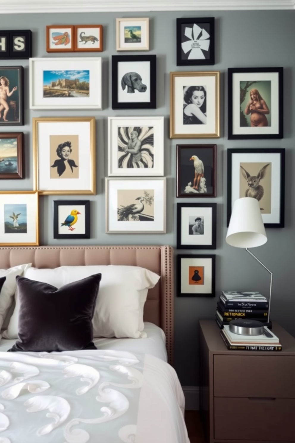 A cozy bedroom featuring a gallery wall adorned with an eclectic mix of framed art pieces in various sizes and styles. The bed is dressed in soft linens with a plush headboard, and a stylish bedside table holds a modern lamp and a stack of books.