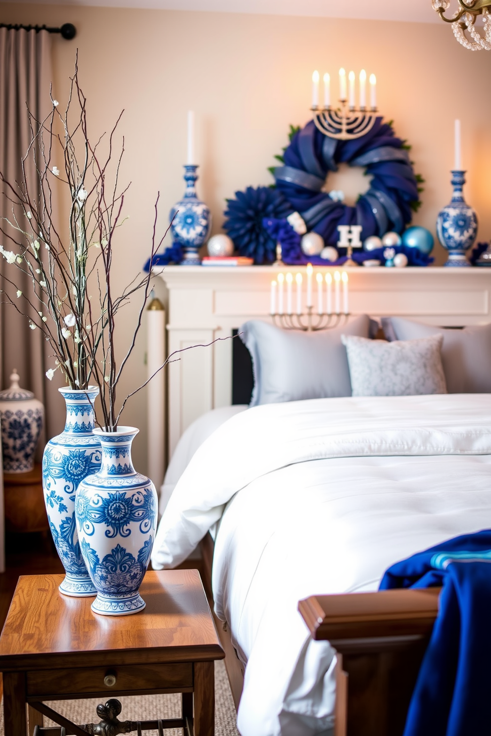 A cozy bedroom adorned with charming holiday-themed decorations. A collection of books featuring festive covers is displayed on a wooden shelf, surrounded by twinkling fairy lights. The bedding is a soft blue with white snowflakes, complemented by plush pillows in various shades of blue and silver. A small menorah sits on the nightstand, casting a warm glow in the inviting atmosphere.