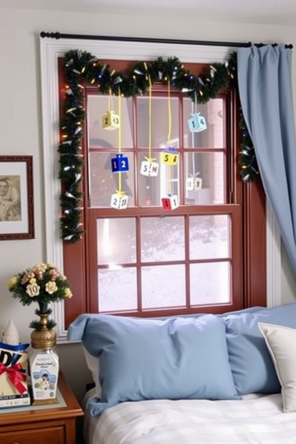 A cozy bedroom adorned for Hanukkah features a beautifully decorated window displaying DIY dreidel ornaments. The ornaments are crafted from colorful materials, hanging gracefully to create a festive atmosphere, while soft blue and white bedding complements the holiday theme.