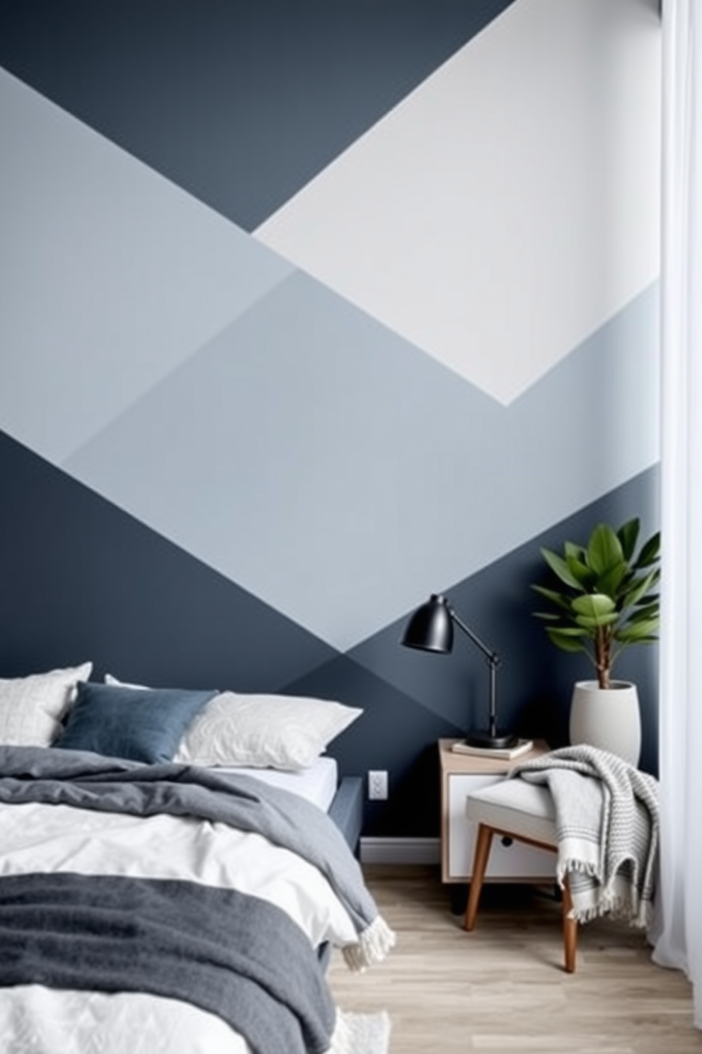 A contemporary bedroom featuring painted geometric shapes on the walls in a soft palette of blues and grays. The design includes a bold accent wall with overlapping triangles, complemented by minimalist furniture and layered textiles.