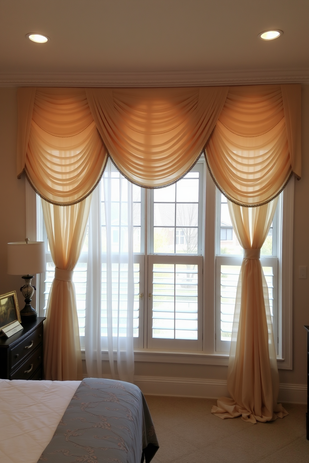 A beautifully designed bedroom features large windows adorned with elegant decorative valances that complement the overall decor. The valances are crafted from luxurious fabric in soft hues, adding a polished finish to the room's aesthetic while allowing natural light to filter through. The window design includes sheer curtains that gracefully drape alongside the valances, creating a layered look that enhances the sense of space. This combination not only elevates the visual appeal but also provides privacy without sacrificing brightness.