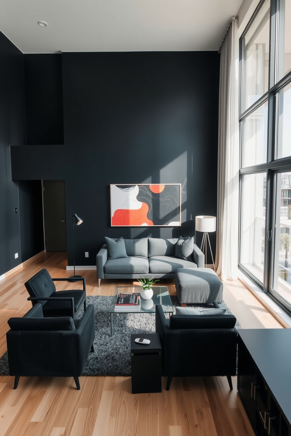 A sleek black apartment features light-colored wooden flooring that contrasts beautifully with the dark walls. Large windows allow natural light to flood the space, highlighting the modern furnishings and minimalist decor. The living area is anchored by a plush gray sofa and a glass coffee table, surrounded by black accent chairs. A bold piece of abstract art hangs on the wall, adding a pop of color to the otherwise monochromatic palette.