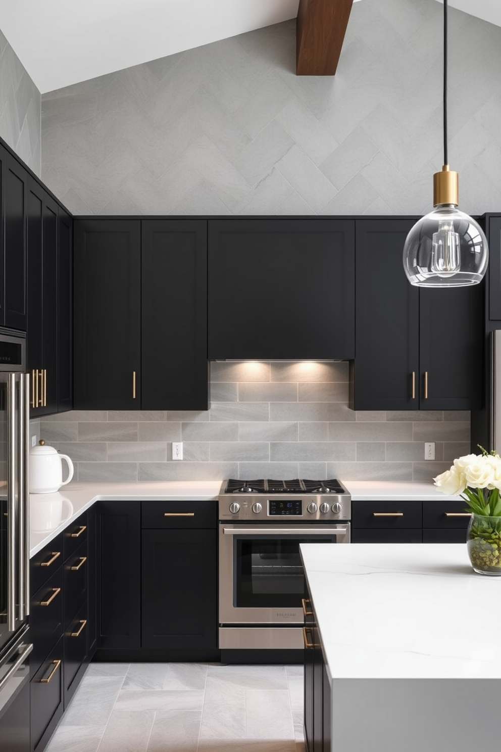 A sleek kitchen design featuring matte black cabinets that exude sophistication. The space is complemented by stainless steel appliances and a large island with a white quartz countertop. The walls are adorned with subtle gray tiles, creating a modern backdrop. Pendant lights with a minimalist design hang above the island, adding a touch of elegance to the overall aesthetic.