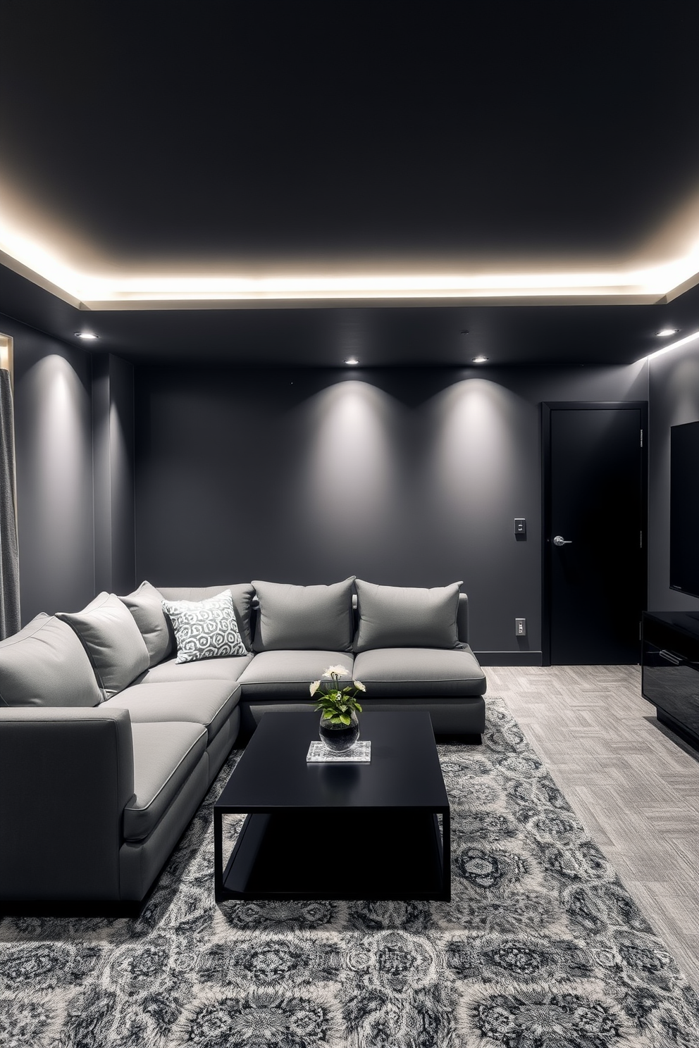 A modern basement design featuring a black and gray color palette. The walls are painted in a deep charcoal gray, complemented by sleek black furniture and fixtures. Soft ambient lighting highlights the space, creating a cozy atmosphere. A plush gray sectional sofa is arranged around a minimalist black coffee table, perfect for entertaining guests.