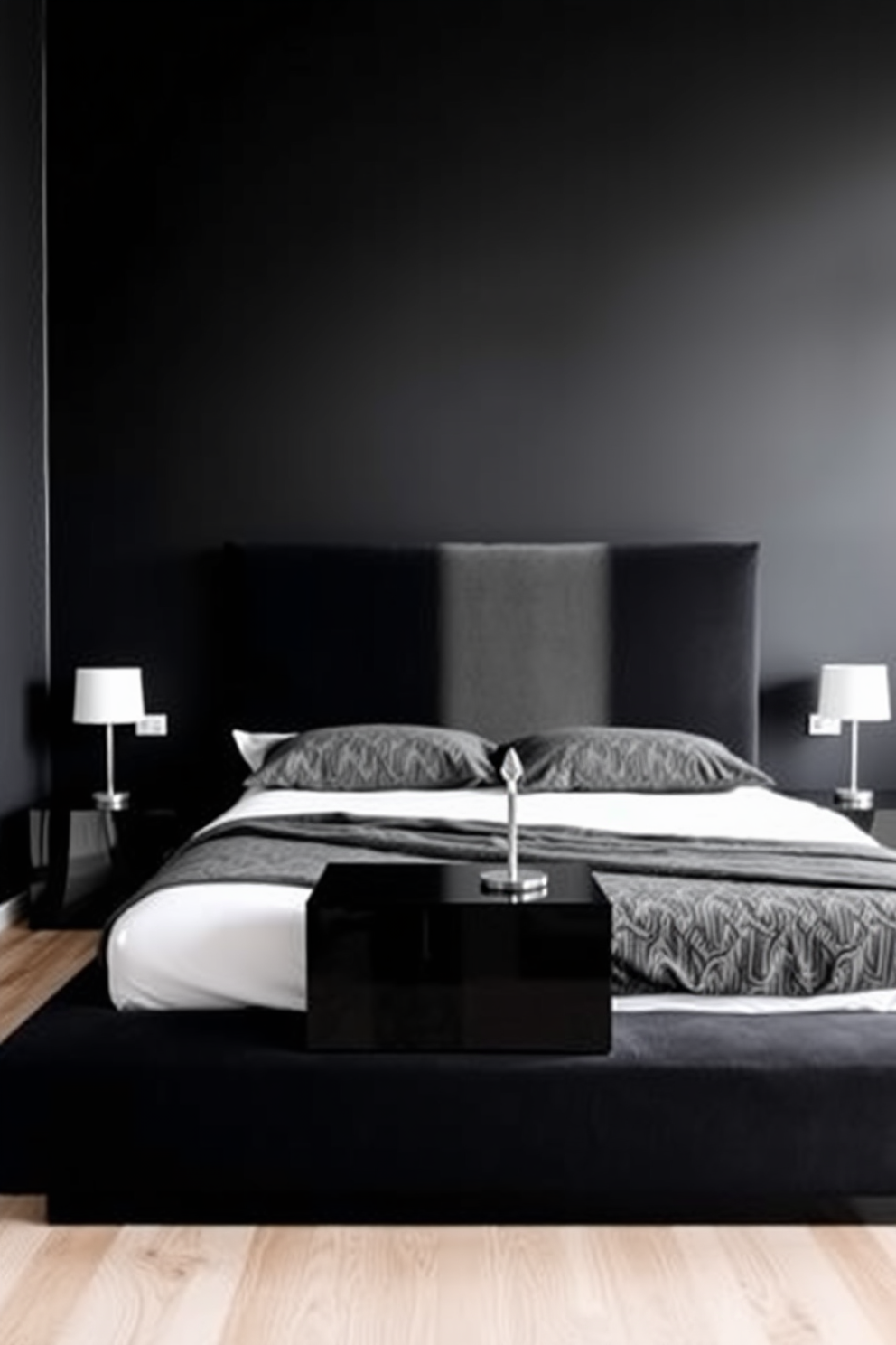 A minimalist black bedroom design features a sleek platform bed with a black upholstered headboard. The walls are painted a deep matte black, creating a cozy and intimate atmosphere. A pair of modern bedside tables in a glossy black finish flanks the bed, each topped with simple white lamps. The floor is a light natural wood, providing contrast and warmth to the dark color scheme.