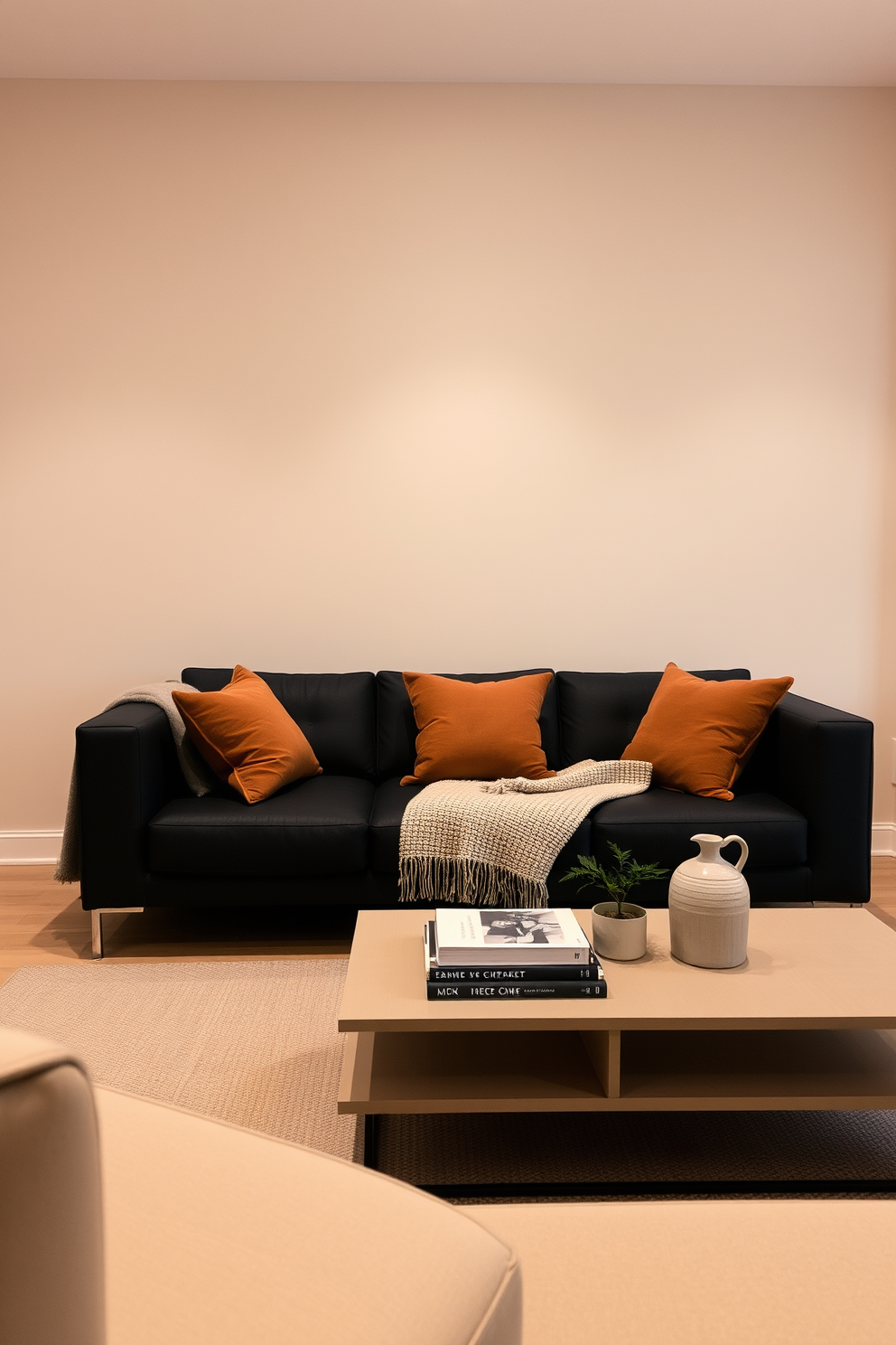 A stylish living room featuring neutral walls that create a harmonious backdrop for bold furniture choices. The centerpiece is a sleek black couch, complemented by vibrant accent chairs and a striking coffee table that adds a touch of elegance to the space.